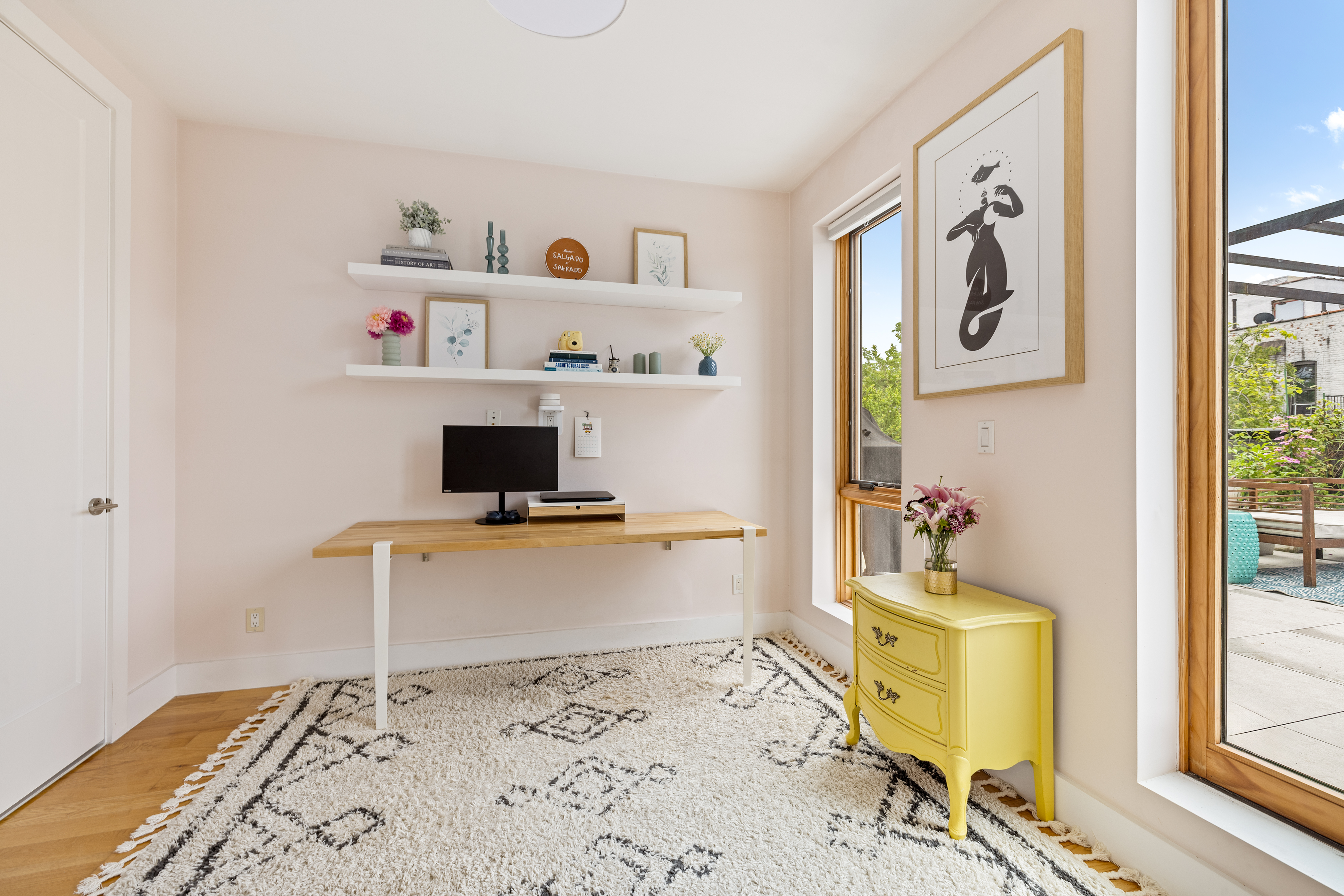 1204 Saint Marks Avenue, Unit 4R Brooklyn, NY 11213 - Photo 9 of 14 a living room with a couch and a table with wooden floor