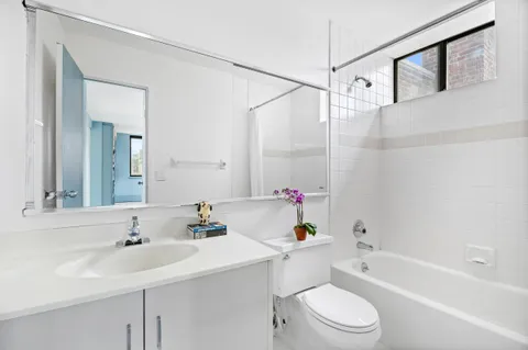 a bathroom with a sink a toilet and a bathtub