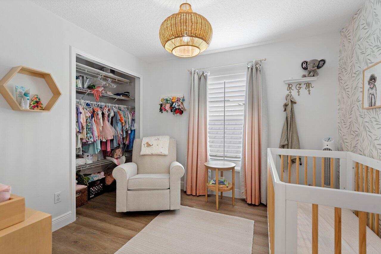 1182 Canoe Point Delray Beach, FL 33444 - Photo 27 of 46 a bedroom with furniture and a window