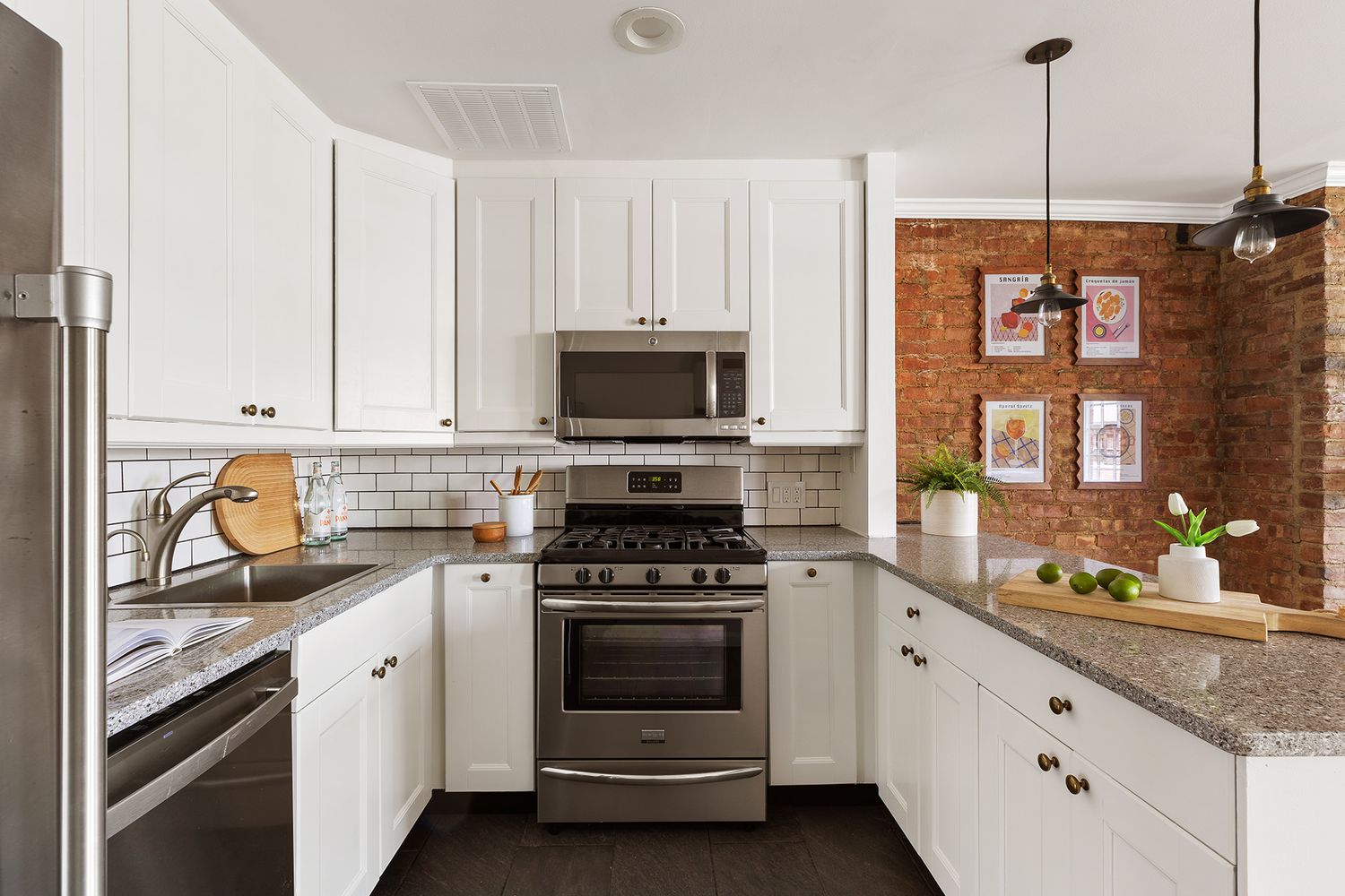 a kitchen with granite countertop a stove and a sink