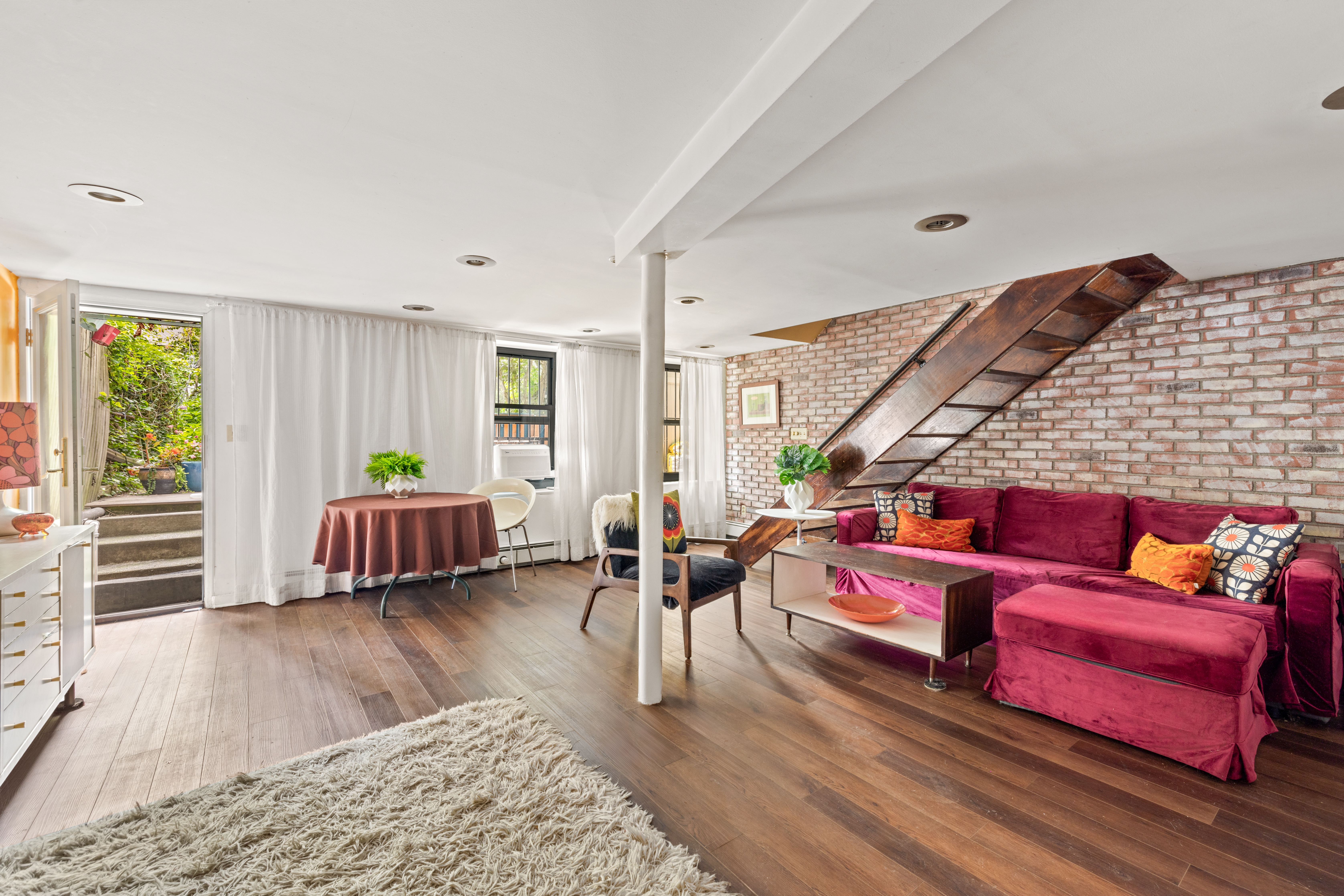 376 Bergen Street, Unit 1R Brooklyn, NY 11217 - Photo 5 of 10 a bedroom with furniture and a wooden floor