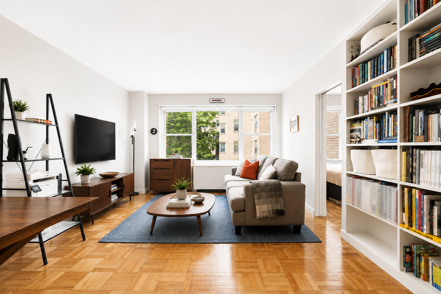 20 East 9th Street, Unit 4T Manhattan, NY 10003 - Photo 1 of 6 a living room with furniture and a flat screen tv