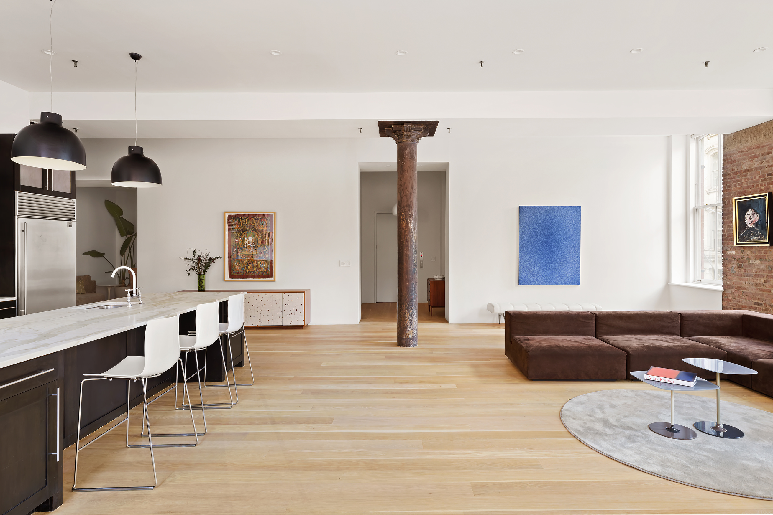 60 Warren Street, Unit 2 Manhattan, NY 10007 - Photo 5 of 16 a living room with furniture and wooden floor