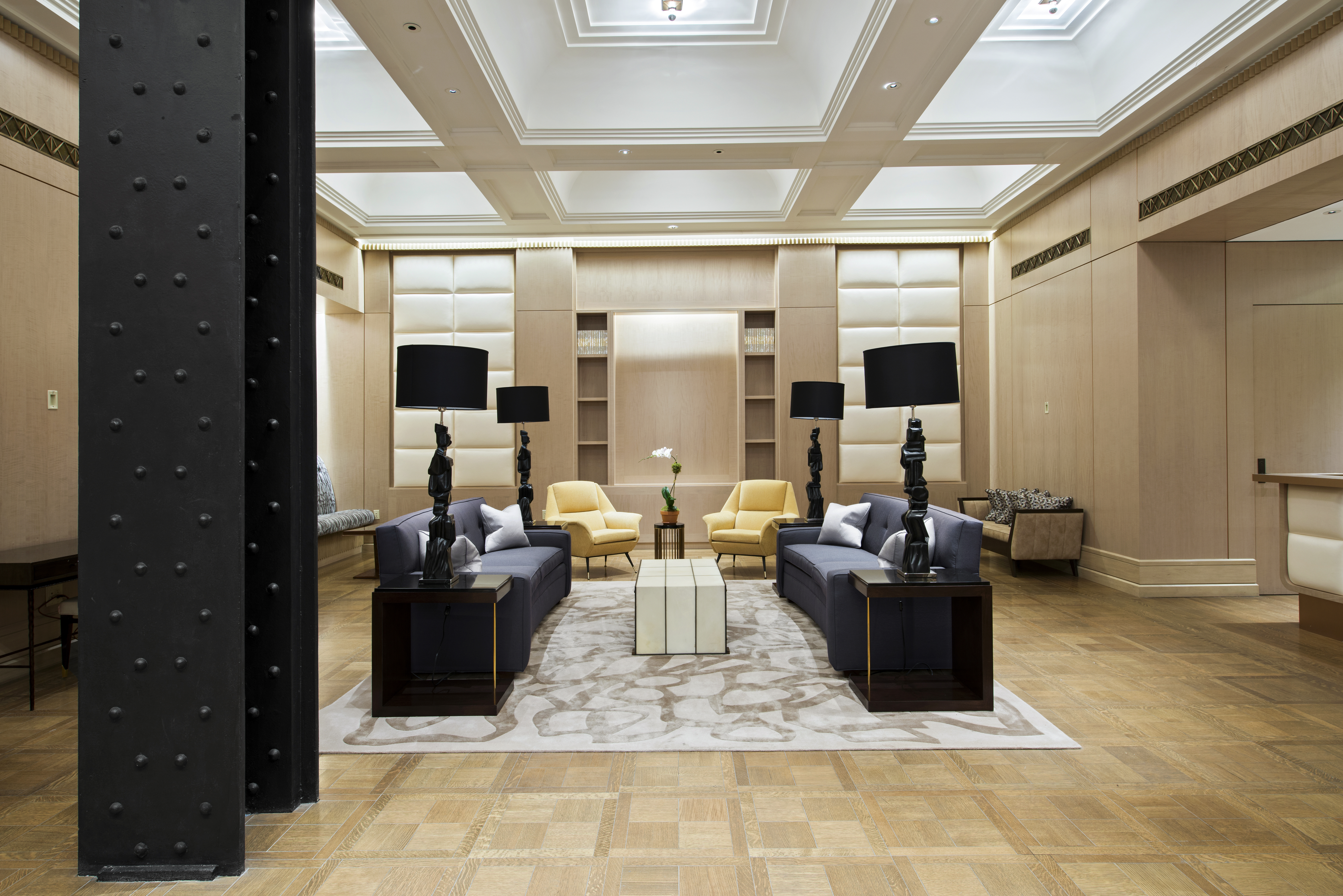 212 West 18th Street, Unit 19C Manhattan, NY 10011 - Photo 21 of 27 a living room with furniture a flat screen tv and kitchen view