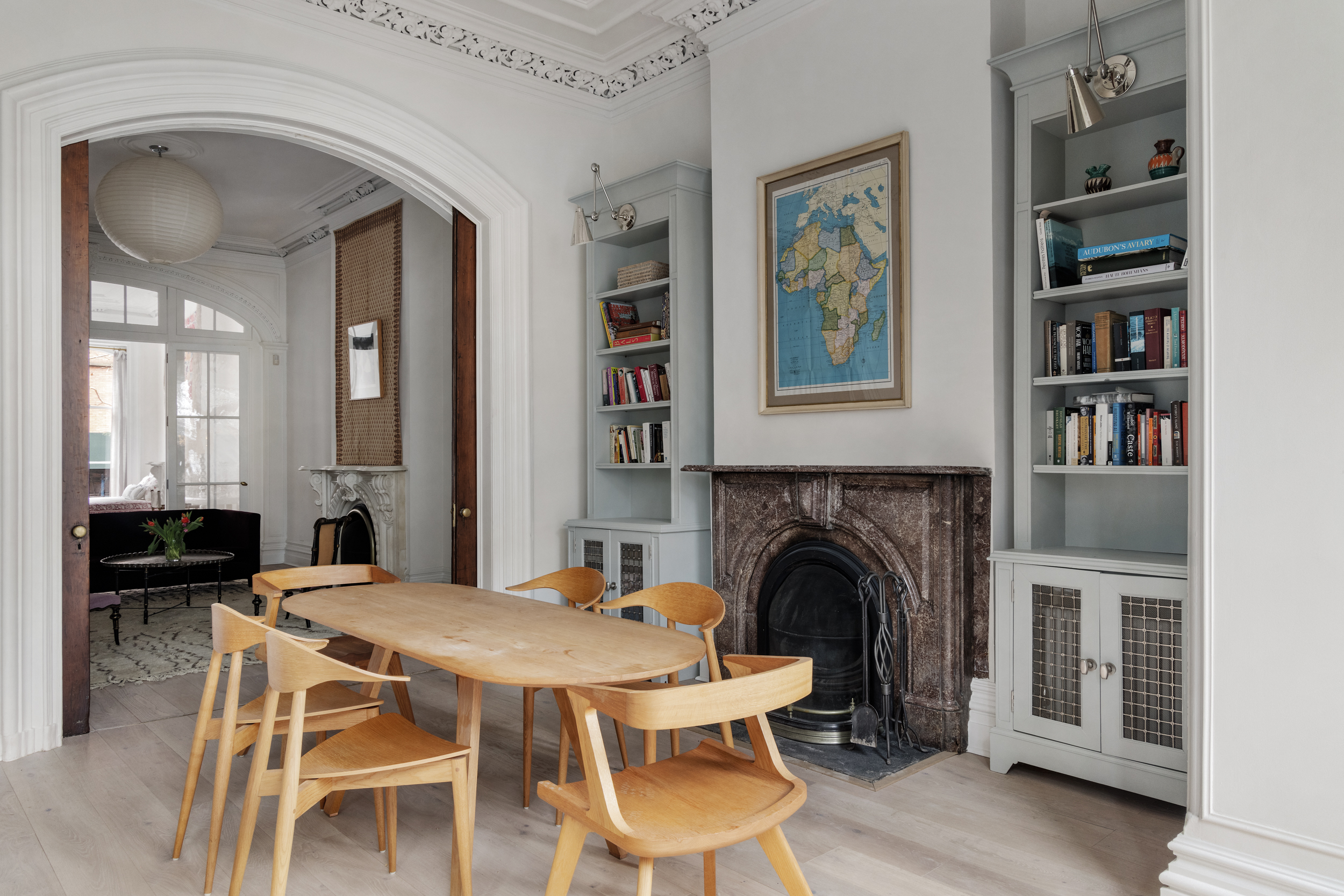 427 West 21st Street, Unit PARLOR Manhattan, NY 10011 - Photo 10 of 19 a living room with furniture a fireplace and a flat screen tv