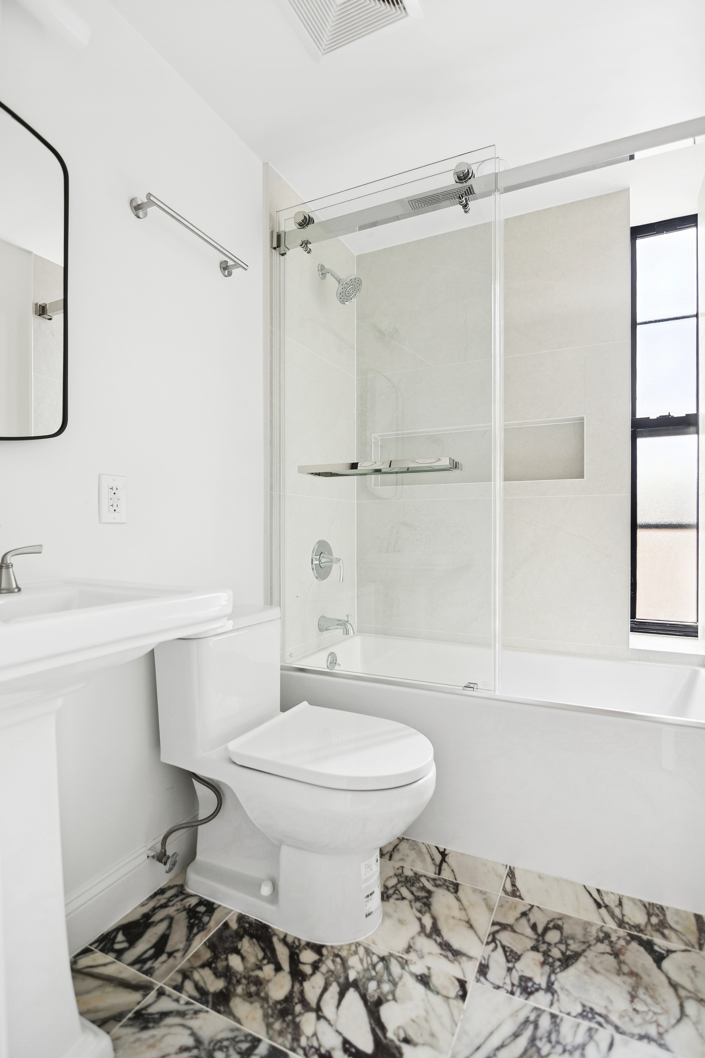298 Degraw Street, Unit 2 Brooklyn, NY 11231 - Photo 9 of 11 a bathroom with a sink toilet a mirror and shower