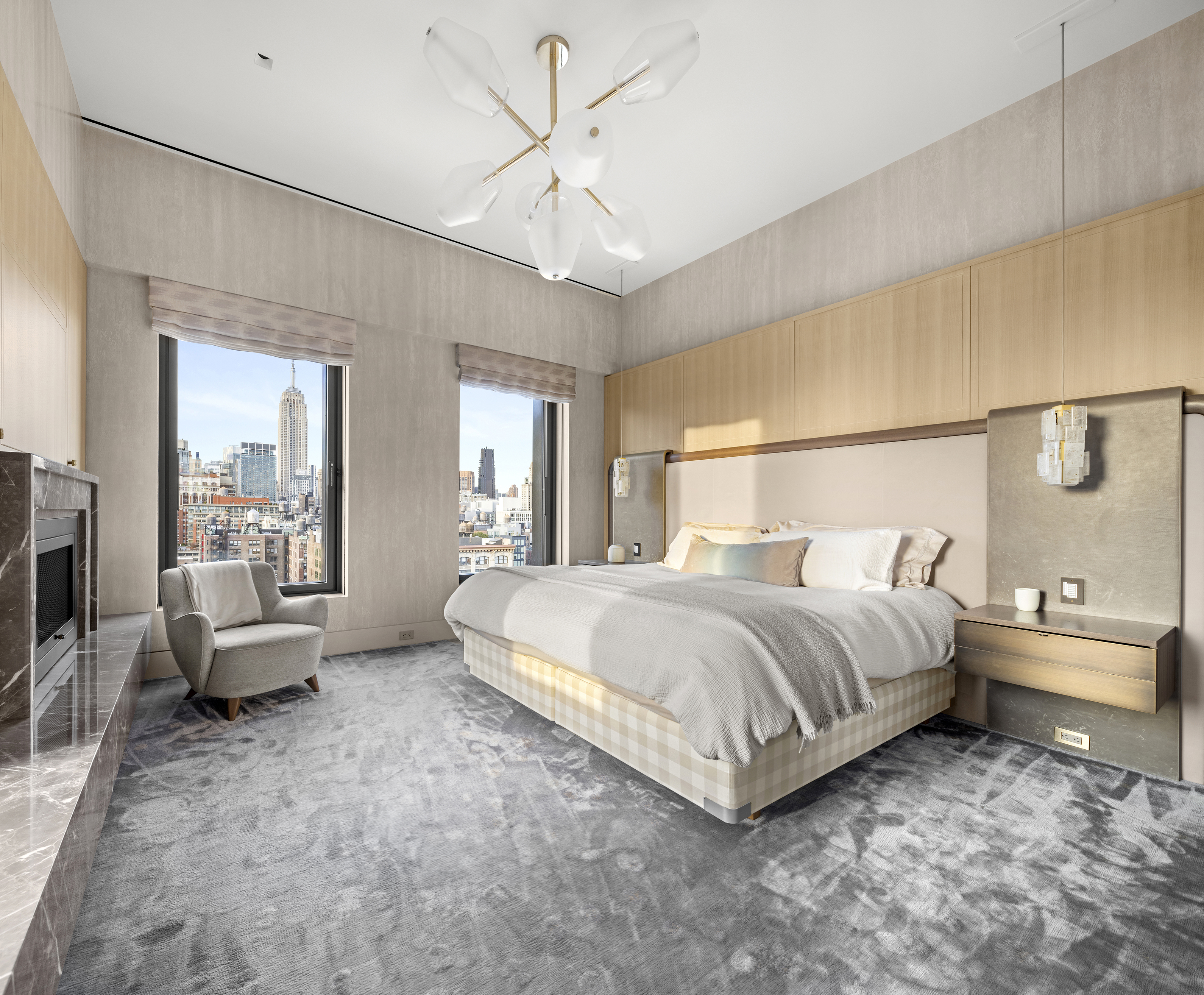 55 West 17th Street, Unit PH Manhattan, NY 10011 - Photo 13 of 36 a spacious bedroom with a bed and wooden floor