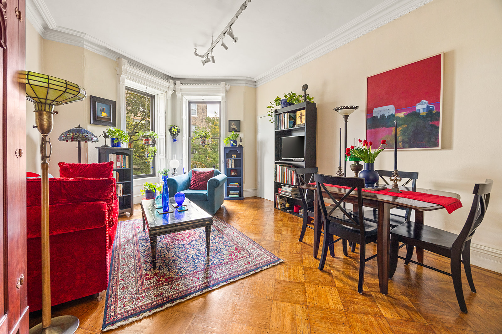 206 Lincoln Place, Unit 7 Brooklyn, NY 11217 - Photo 2 of 9 a living room with furniture a rug and a floor to ceiling window