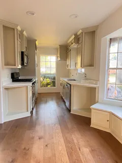 a large kitchen with a stove top oven