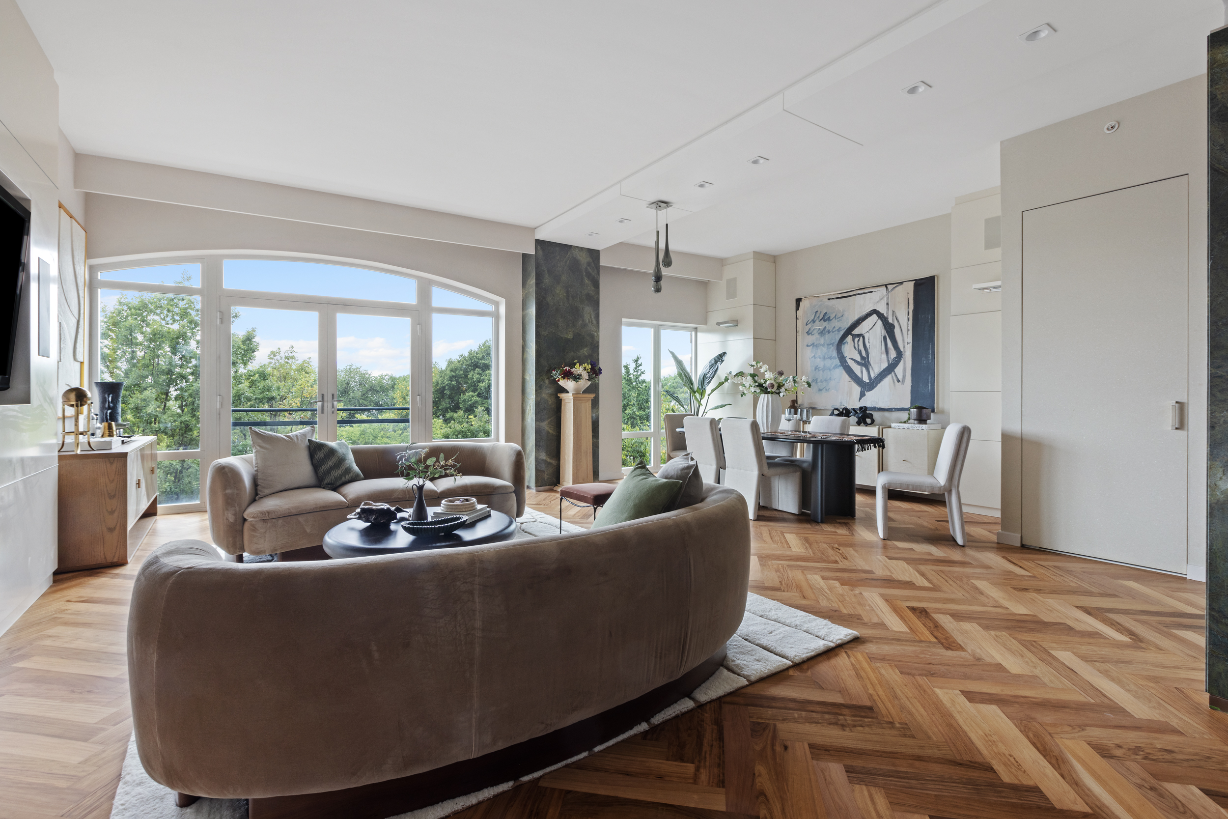 400 West 12th Street, Unit 4E Manhattan, NY 10014 - Photo 4 of 24 a living room with furniture and a large window
