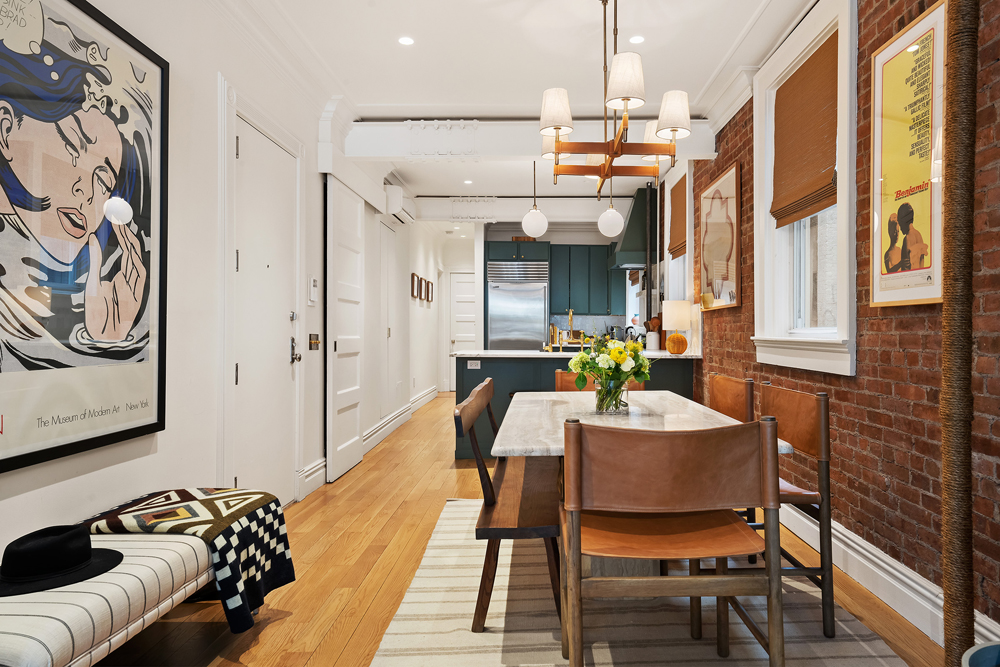 67 Perry Street, Unit 3 Manhattan, NY 10014 - Photo 8 of 22 a dining room with furniture and a chandelier