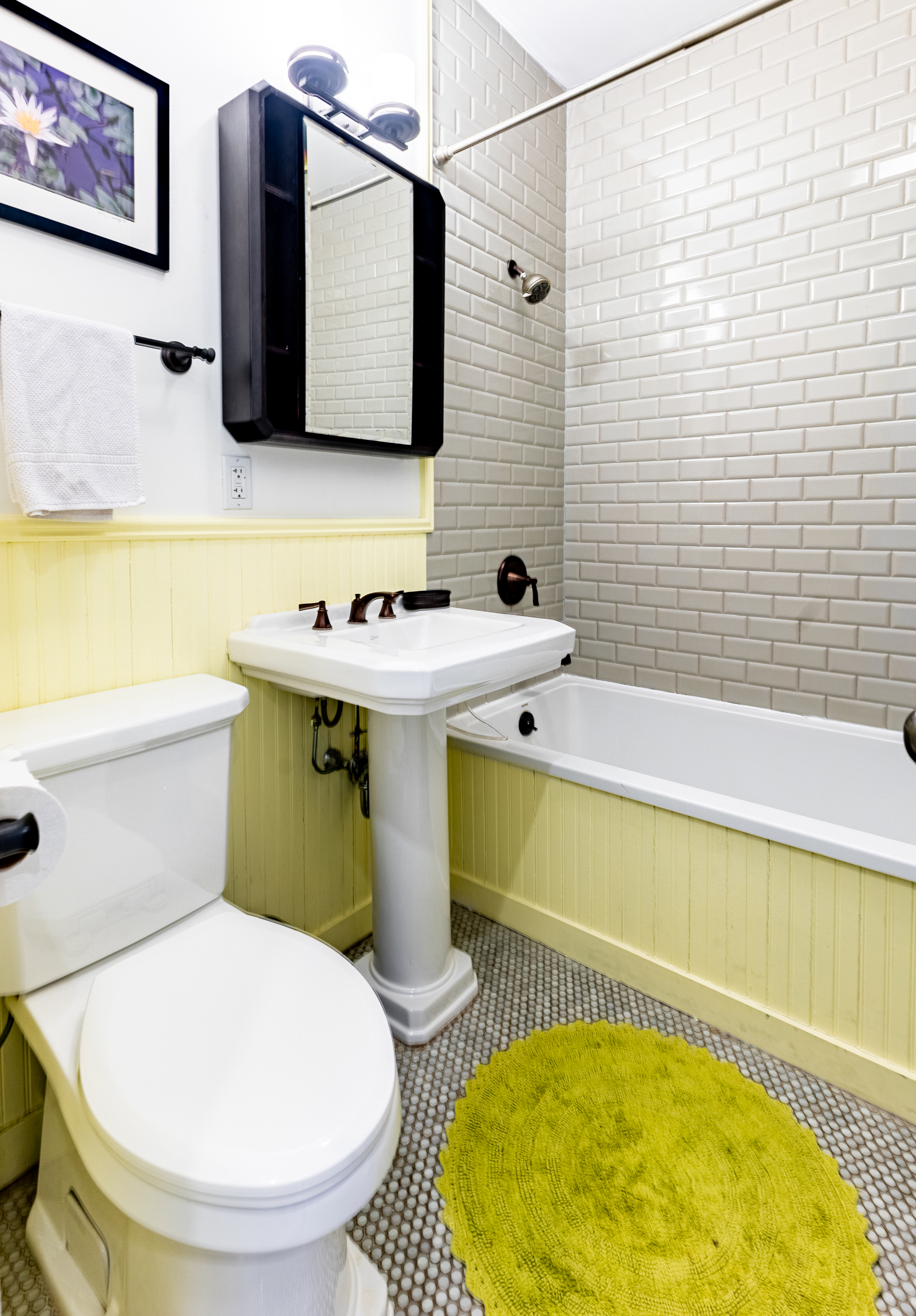 940 Fulton Street, Unit 3B Brooklyn, NY 11238 - Photo 7 of 18 a bathroom with a sink and a mirror