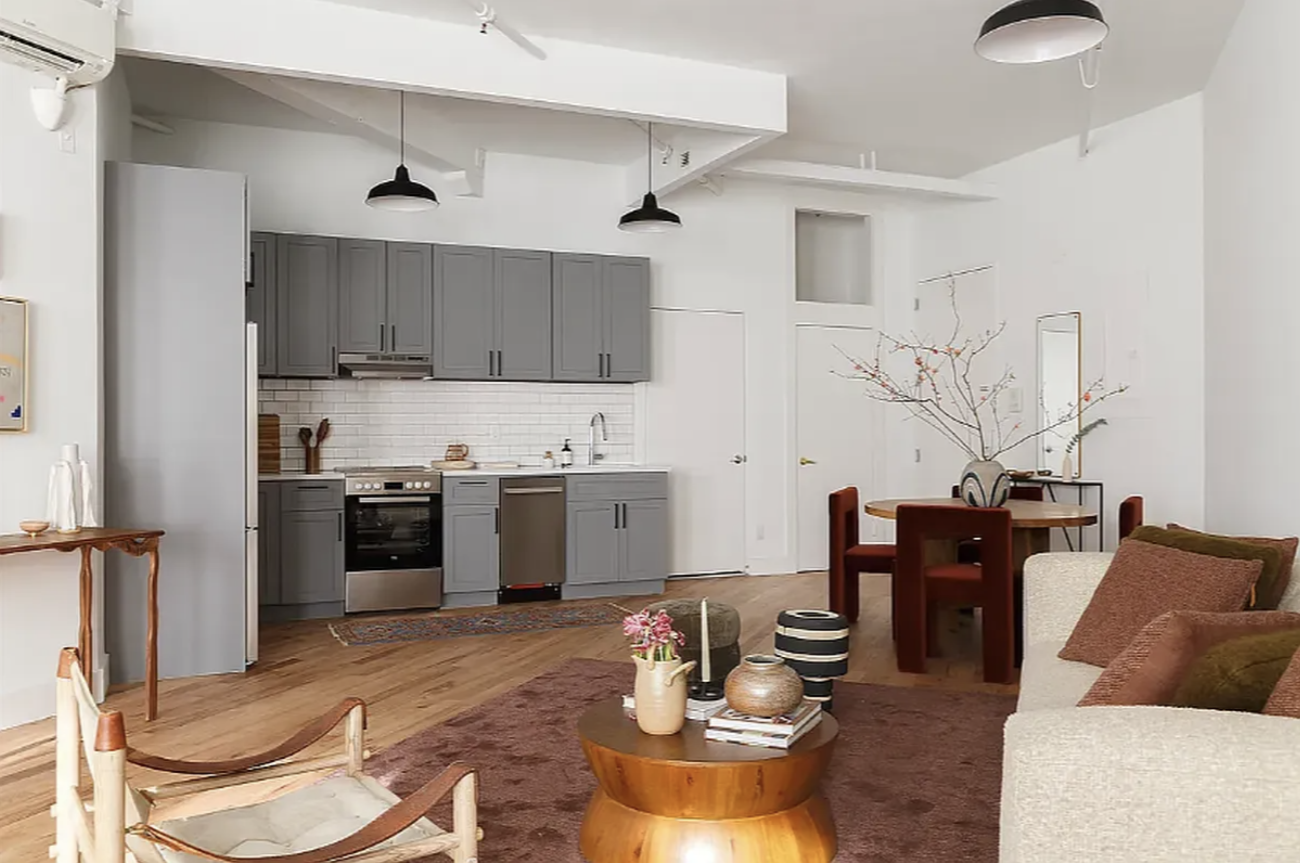 239 Banker Street Brooklyn, NY 11222 - Photo 6 of 11 a living room with stainless steel appliances kitchen island granite countertop furniture and a kitchen view