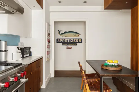 a kitchen with a table and chairs