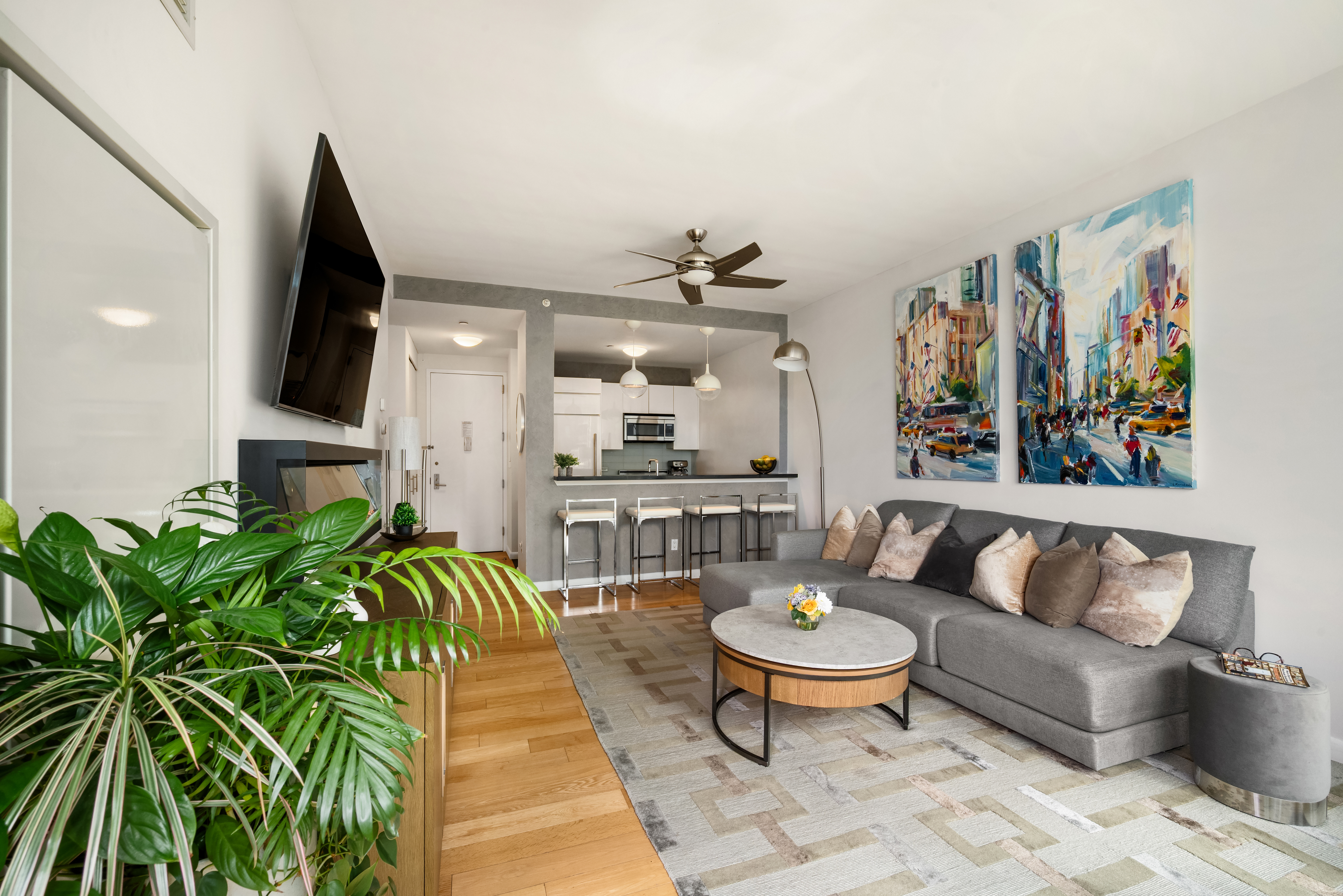 46-30 Center Boulevard, Unit 707 Queens, NY 11109 - Photo 3 of 23 a living room with furniture and a rug