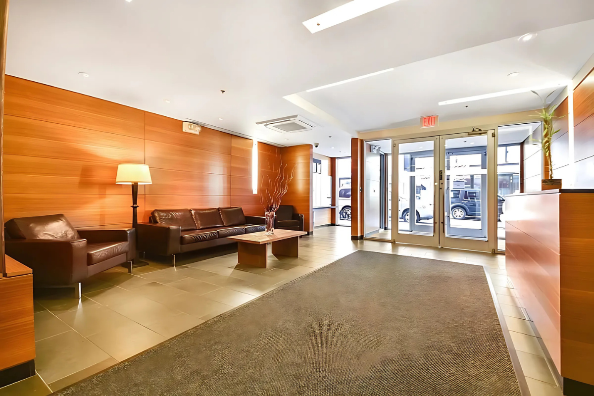 154 Attorney Street, Unit 304 Manhattan, NY 10002 - Photo 10 of 13 a living room with furniture and large windows