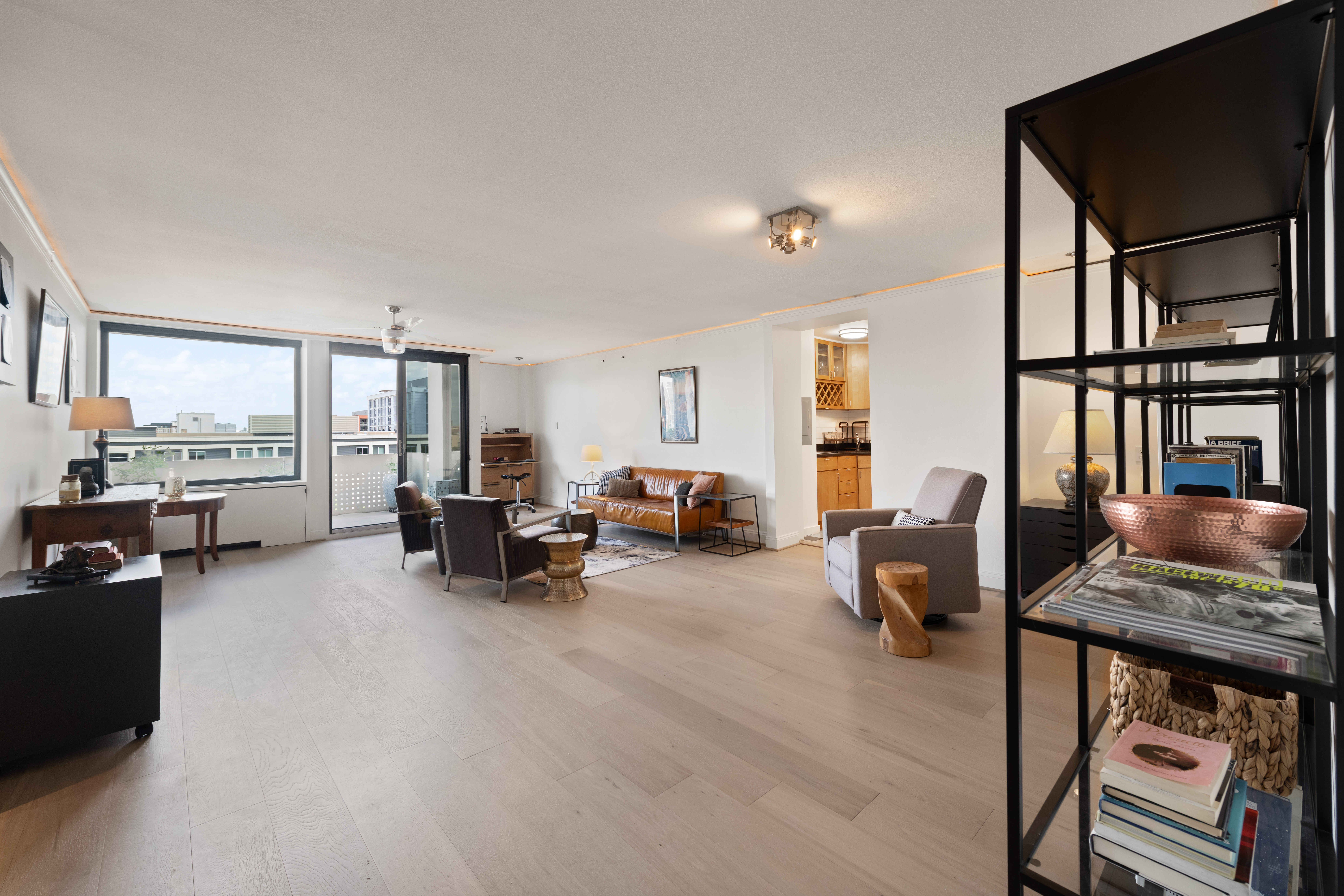 490 M Street Southwest, Unit W802 Washington, DC 20024 - Photo 5 of 24 a living room with furniture and a flat screen tv