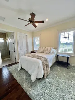 a view of a livingroom with furniture and a book shelf