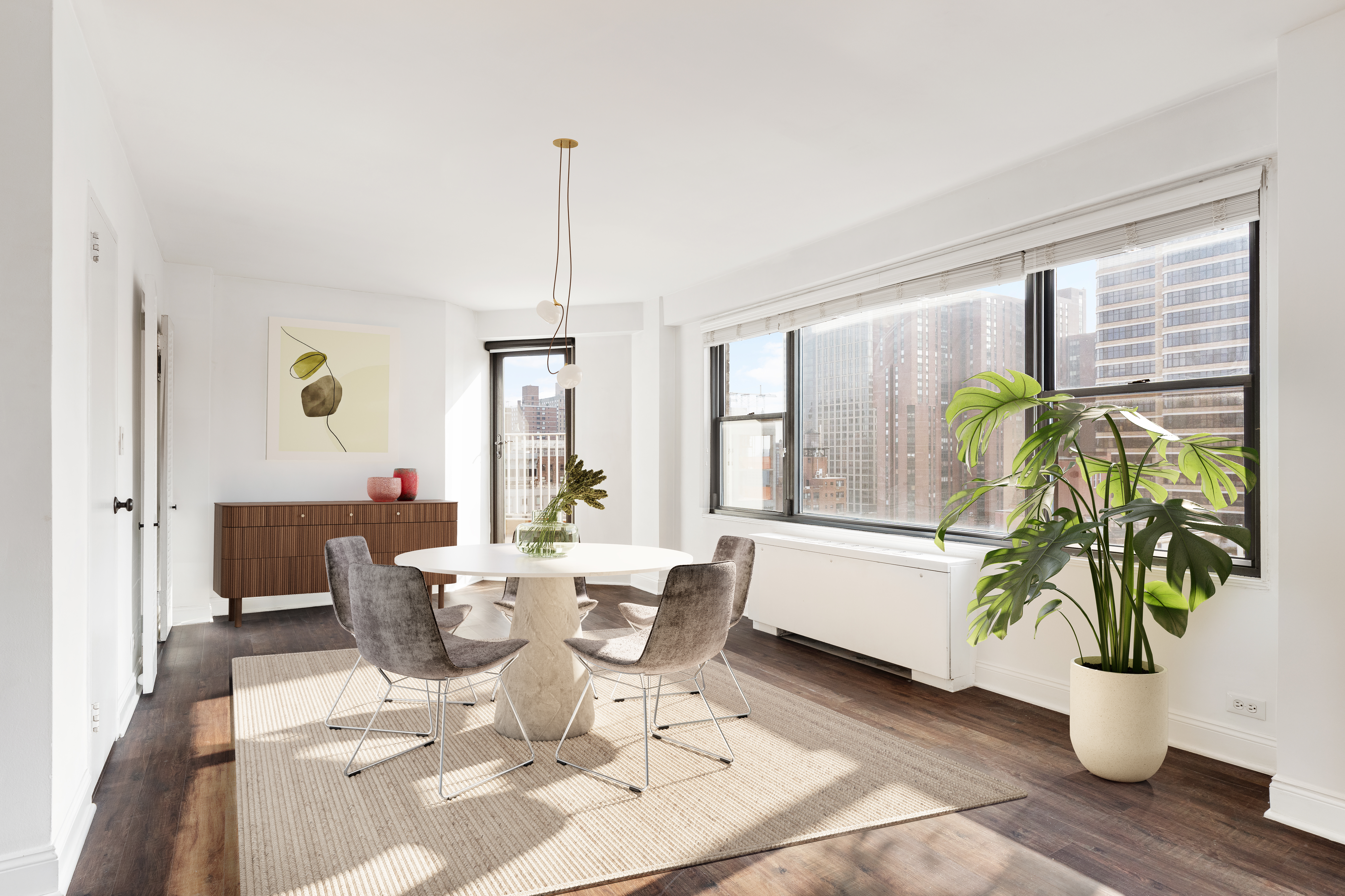 120 East 90th Street, Unit 16E Manhattan, NY 10128 - Photo 3 of 15 a living room with a large window and furniture