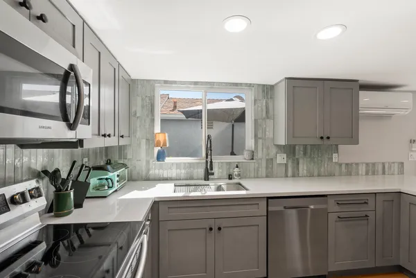 a bathroom with a sink a mirror and a toilet