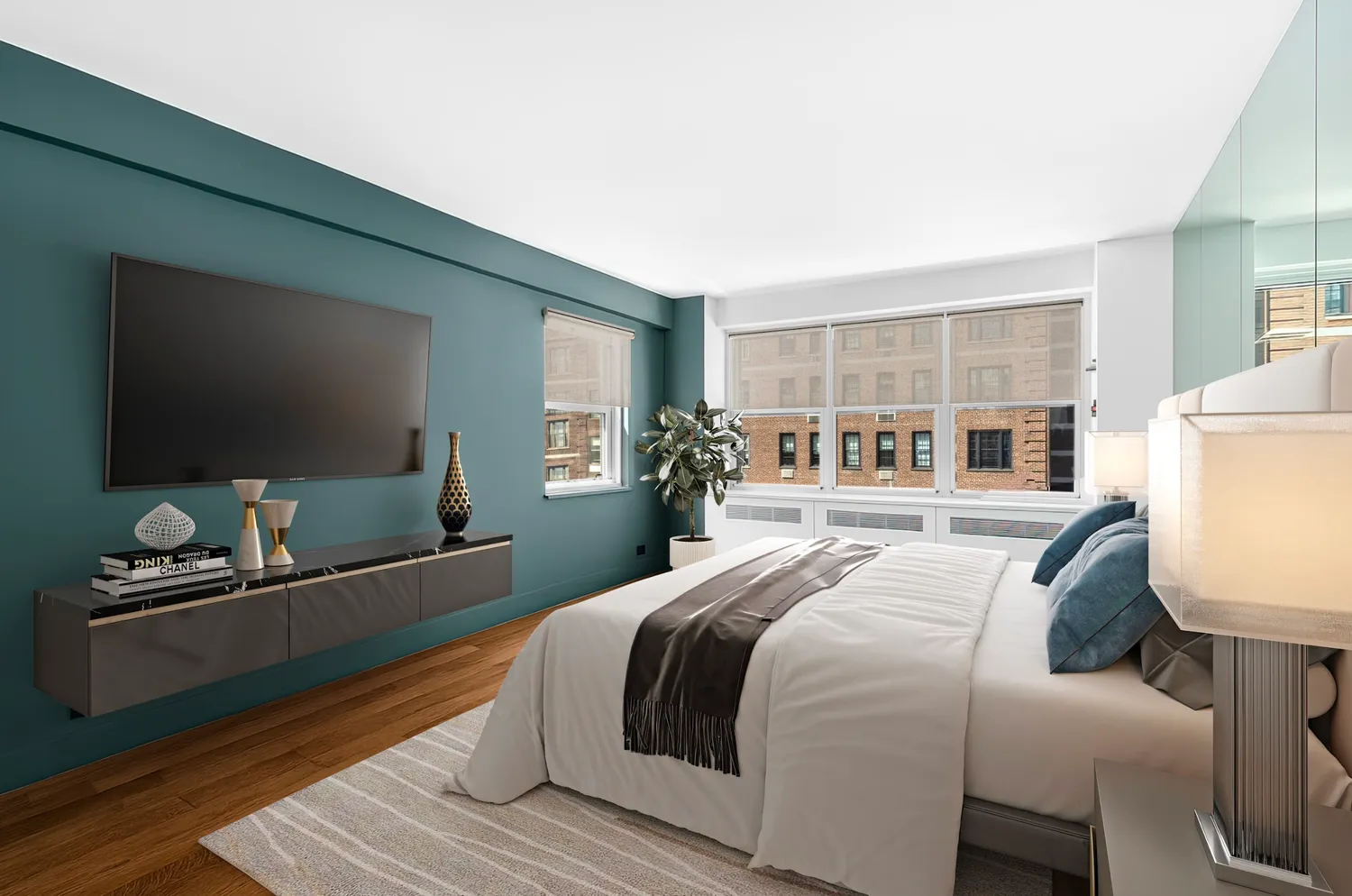 a bedroom with a bed and a flat screen tv