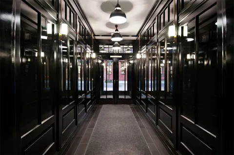 a view of a hallway with chandelier