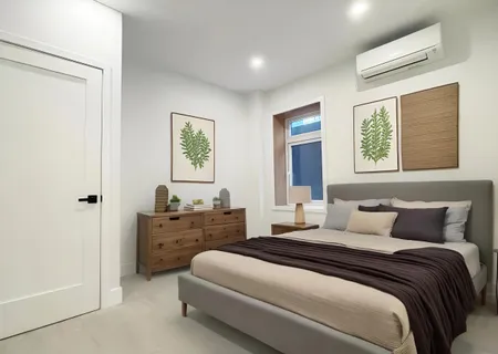 a bedroom with a bed and window