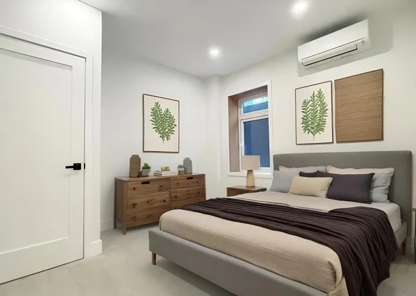 a bedroom with a bed and window