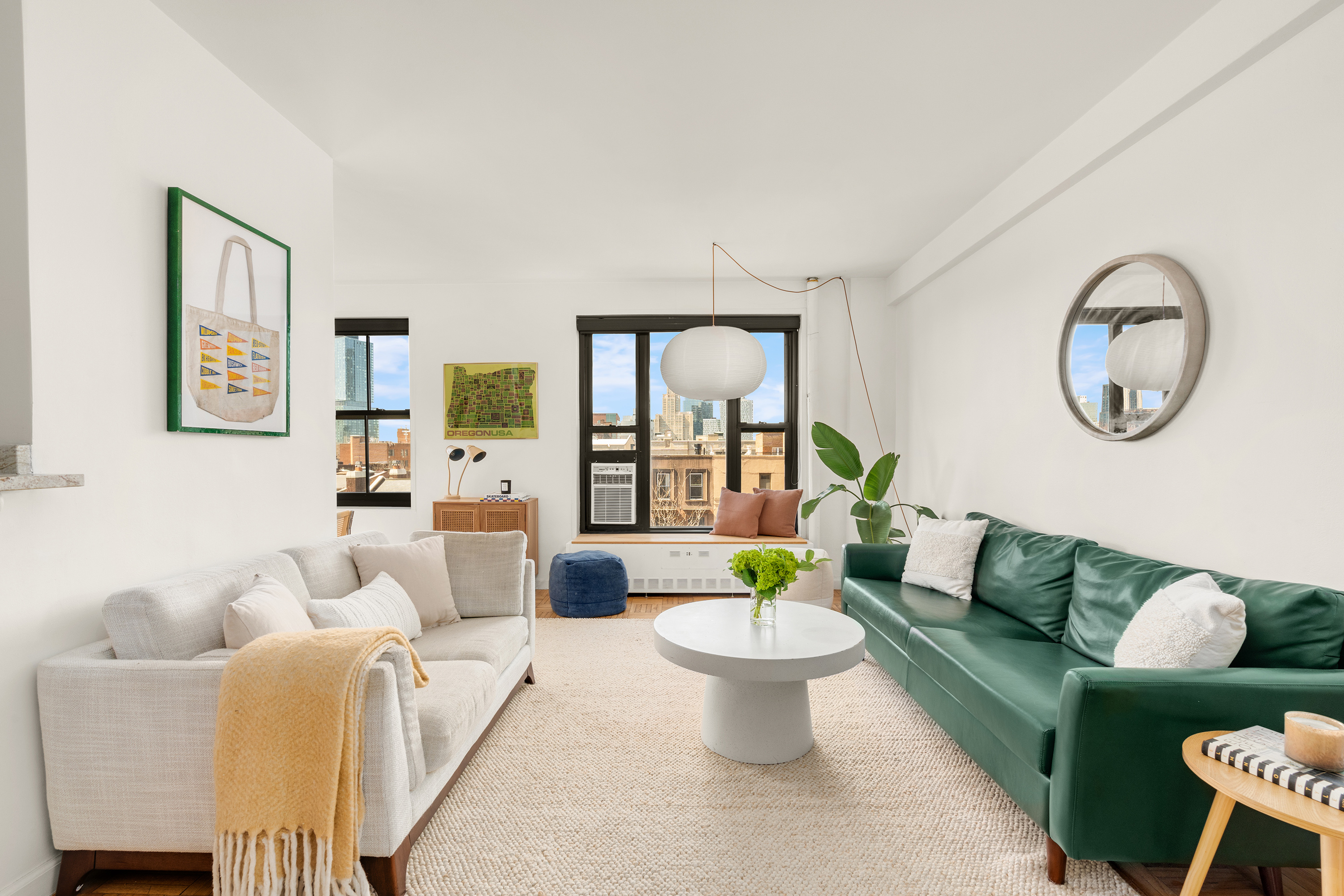 361 Clinton Avenue, Unit 7D Brooklyn, NY 11238 - Photo 2 of 10 a living room with furniture a couch and a table