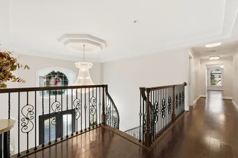 a view of hallway with wooden floor