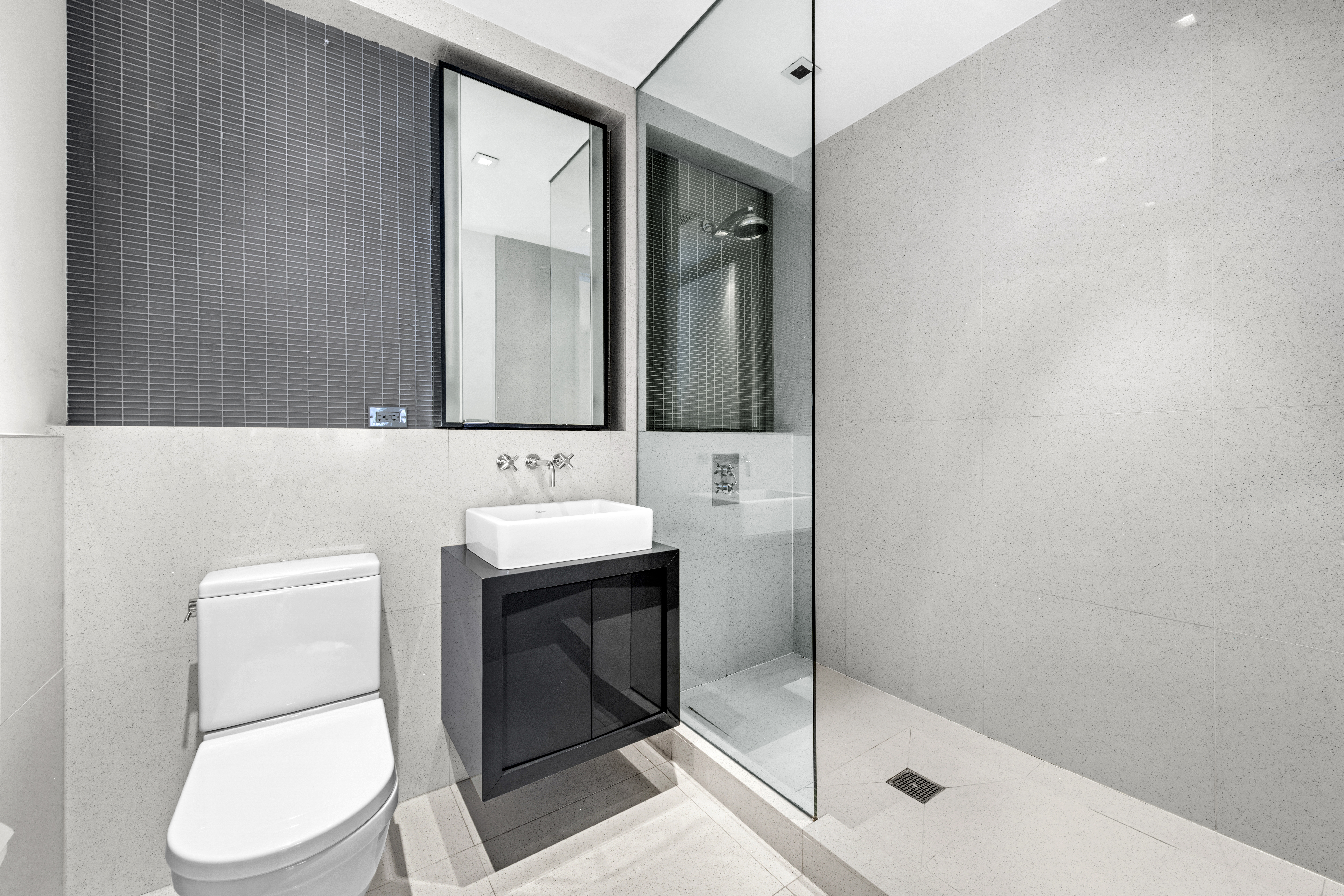 300 East 23rd Street, Unit 7A Manhattan, NY 10010 - Photo 5 of 15 a bathroom with a toilet sink and mirror