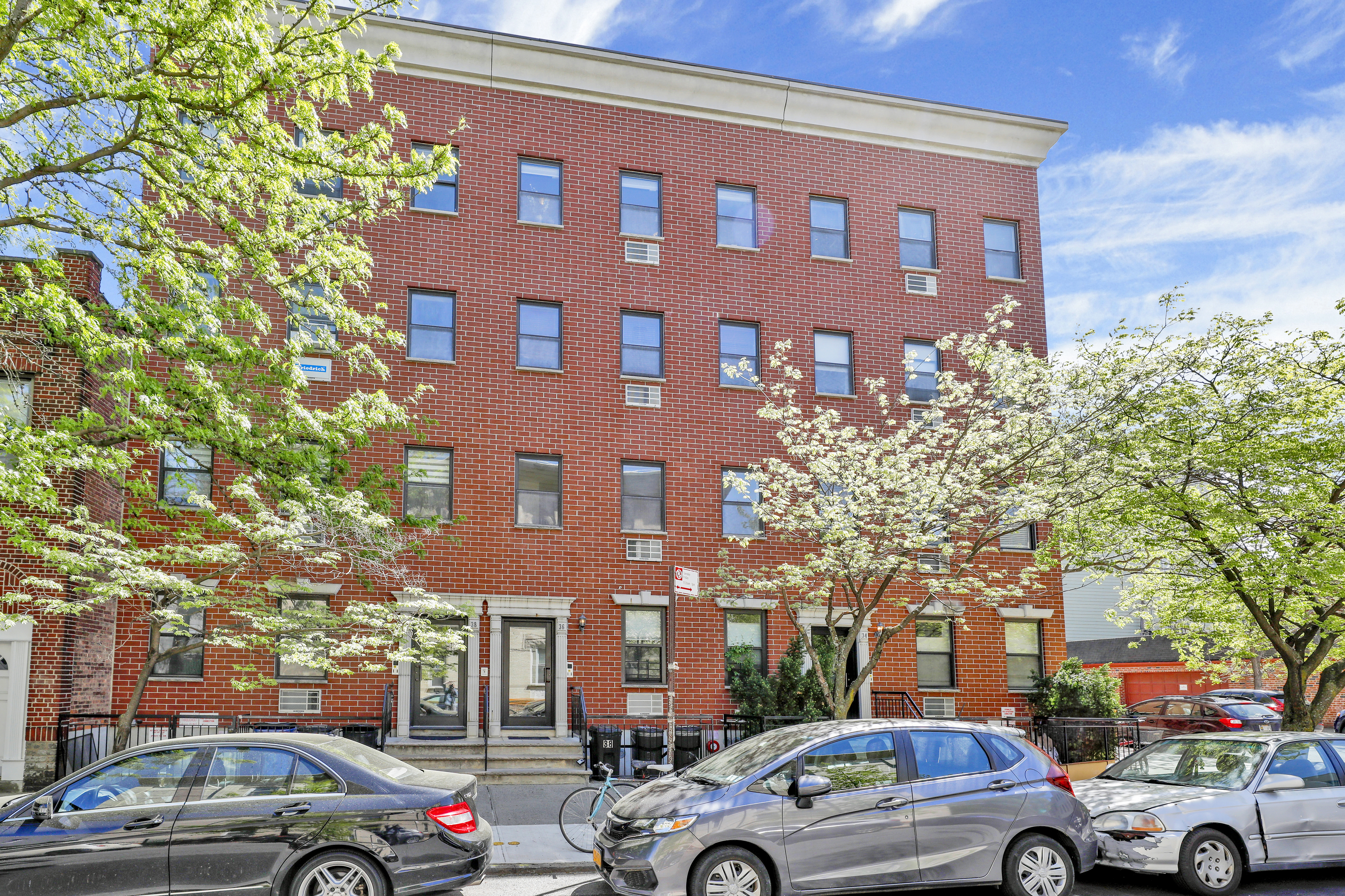 36 Russell Street, Unit 22 Brooklyn, NY 11222 - Photo 26 of 27 a view of a cars parked in front of a building