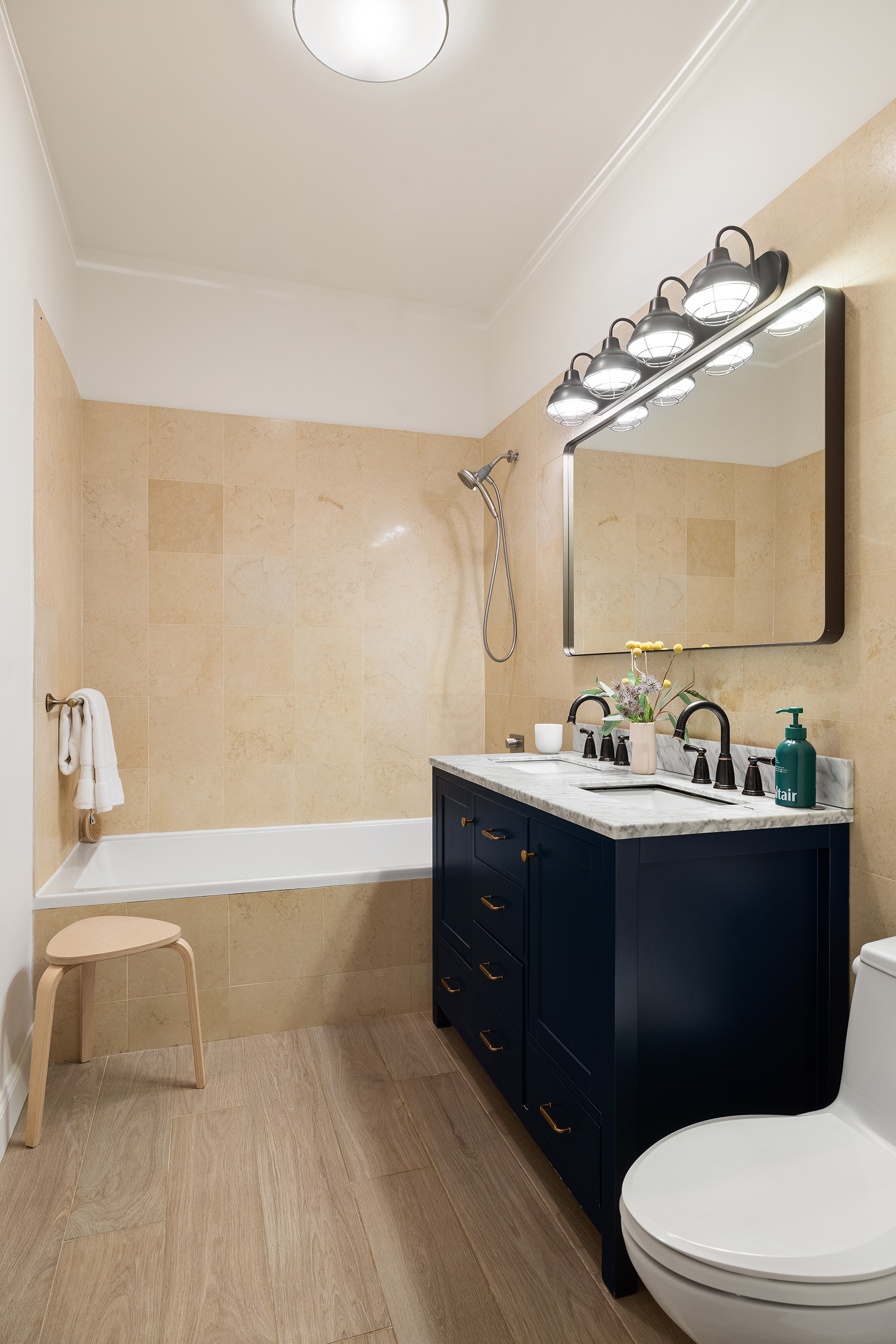 42 East 20th Street, Unit 4AD Manhattan, NY 10003 - Photo 14 of 19 a bathroom with a sink vanity mirror and toilet