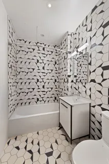 a bathroom with a toilet and a bathtub