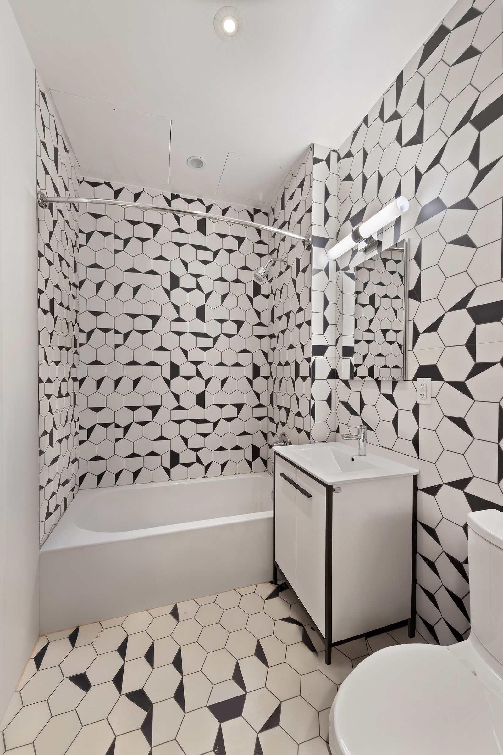 360 Furman Street, Unit 322/323 Brooklyn, NY 11201 - Photo 17 of 42 a bathroom with a toilet and a bathtub