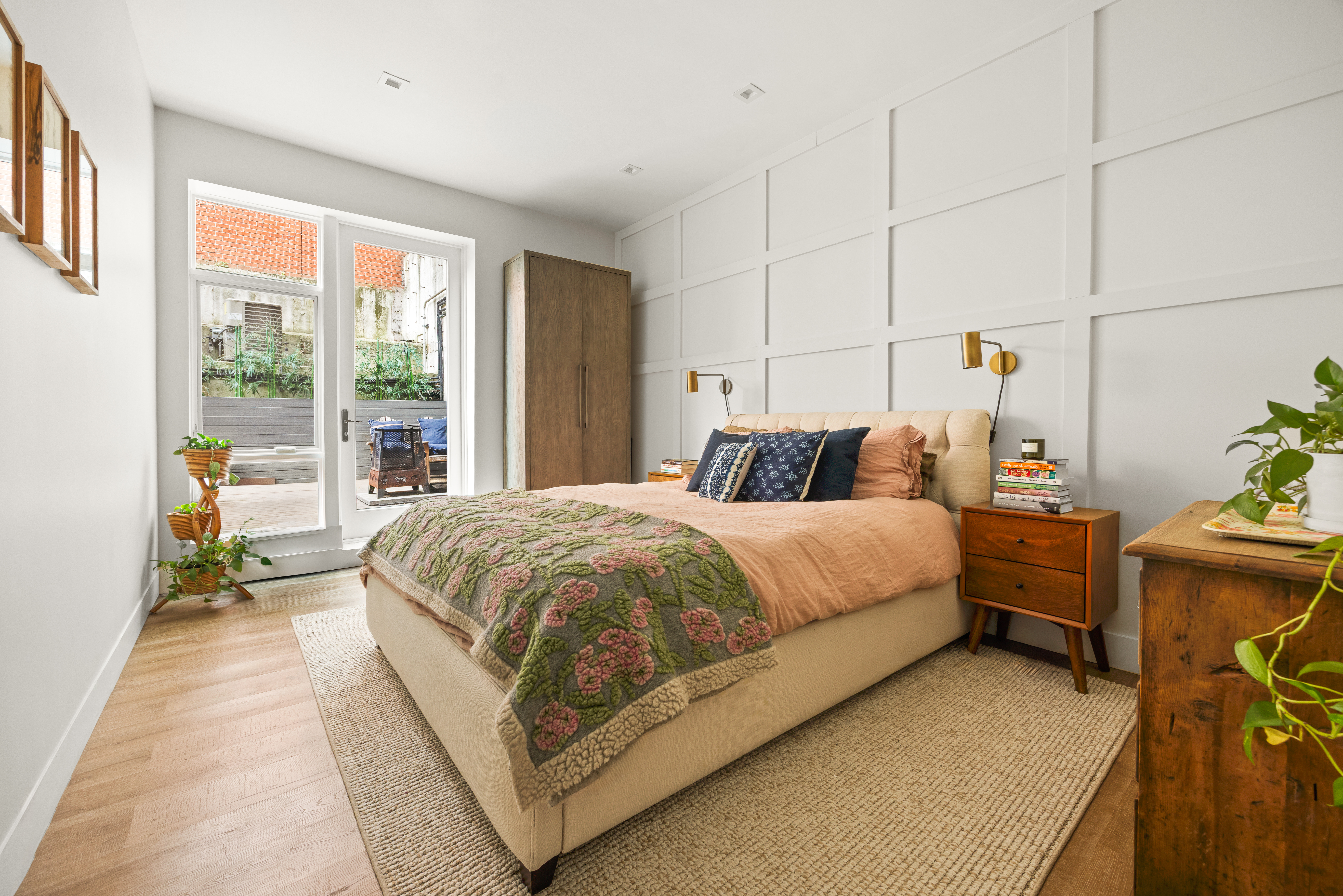 622 Grand Avenue, Unit 103 Brooklyn, NY 11238 - Photo 13 of 19 a large bed sitting in a room next to a window