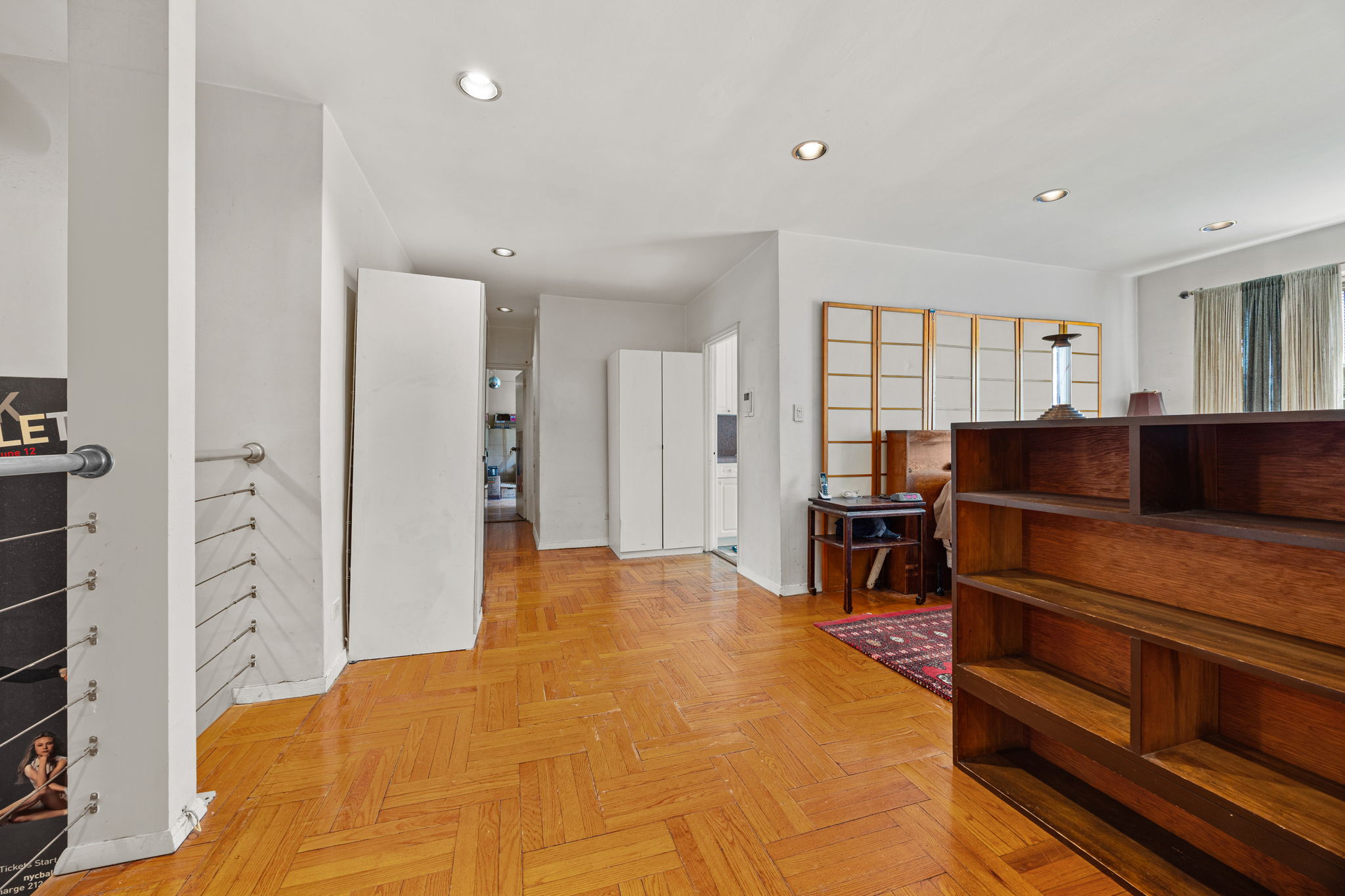 3850 Hudson Manor Terrace, Unit 1EE/2EE Bronx, NY 10463 - Photo 17 of 27 a bedroom with a bed and furniture