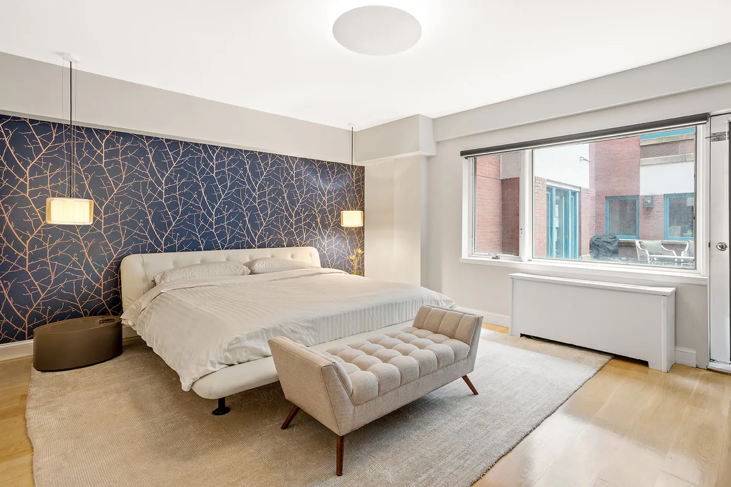 a bedroom with a bed and window