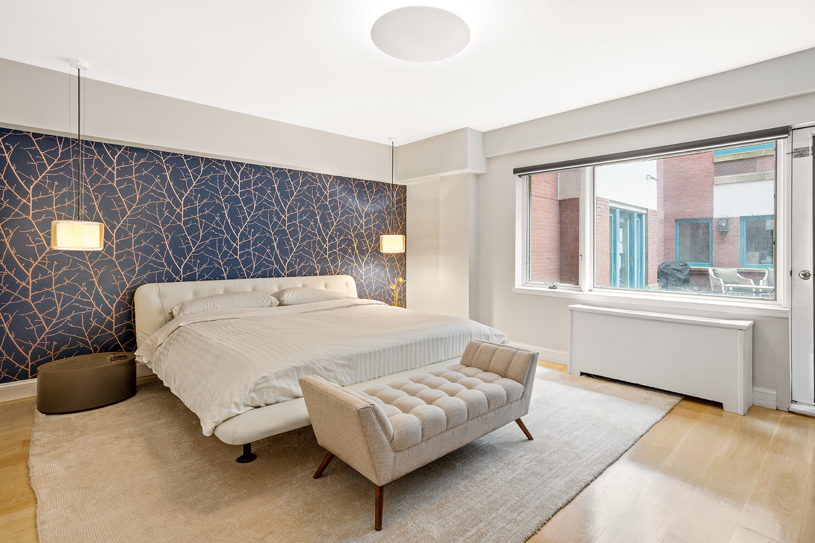 125 East 12th Street, Unit 1E Manhattan, NY 10003 - Photo 6 of 16 a bedroom with a bed and window