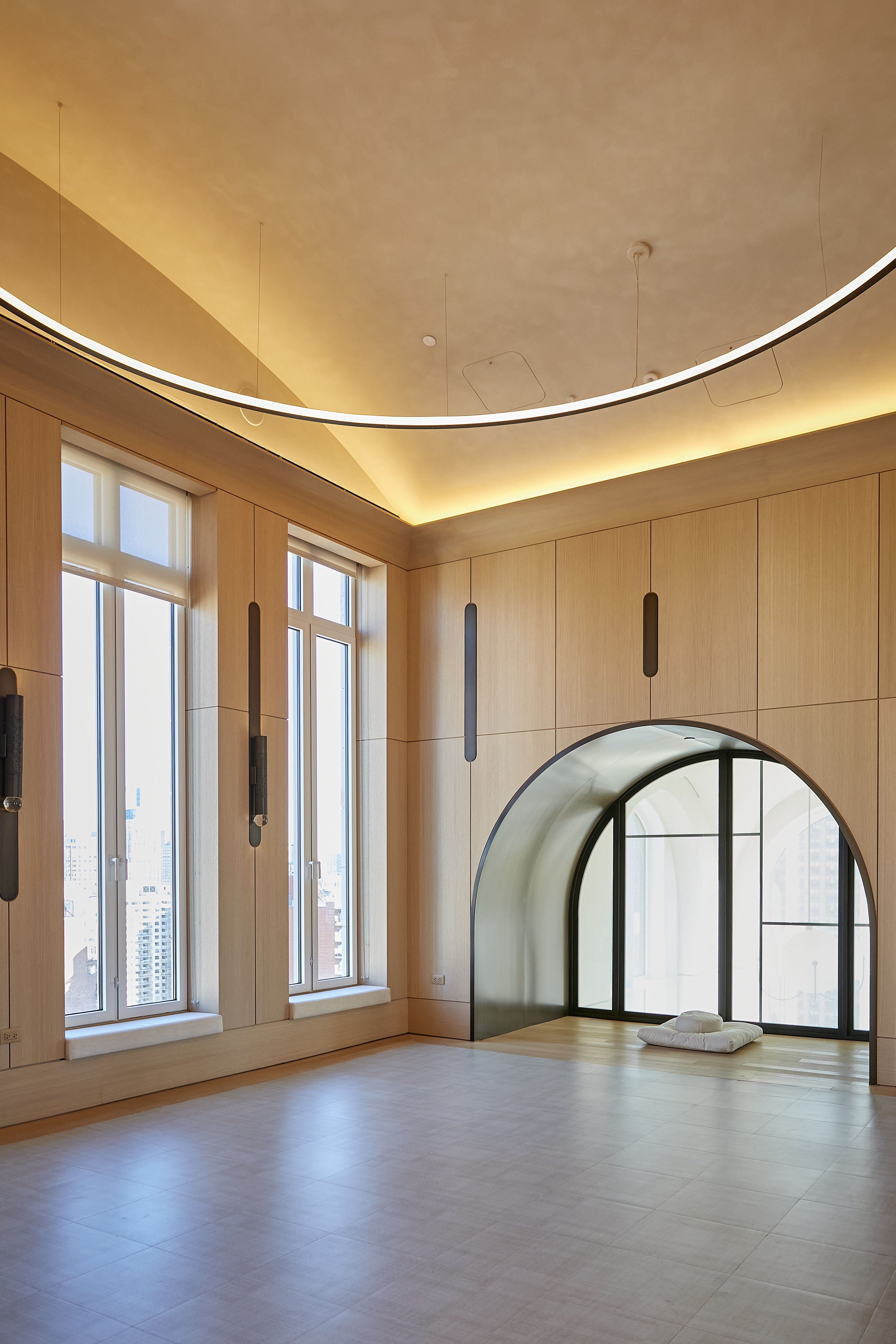 200 East 83rd Street, Unit 34A Manhattan, NY 10028 - Photo 28 of 34 a view of an empty room with wooden floor and windows