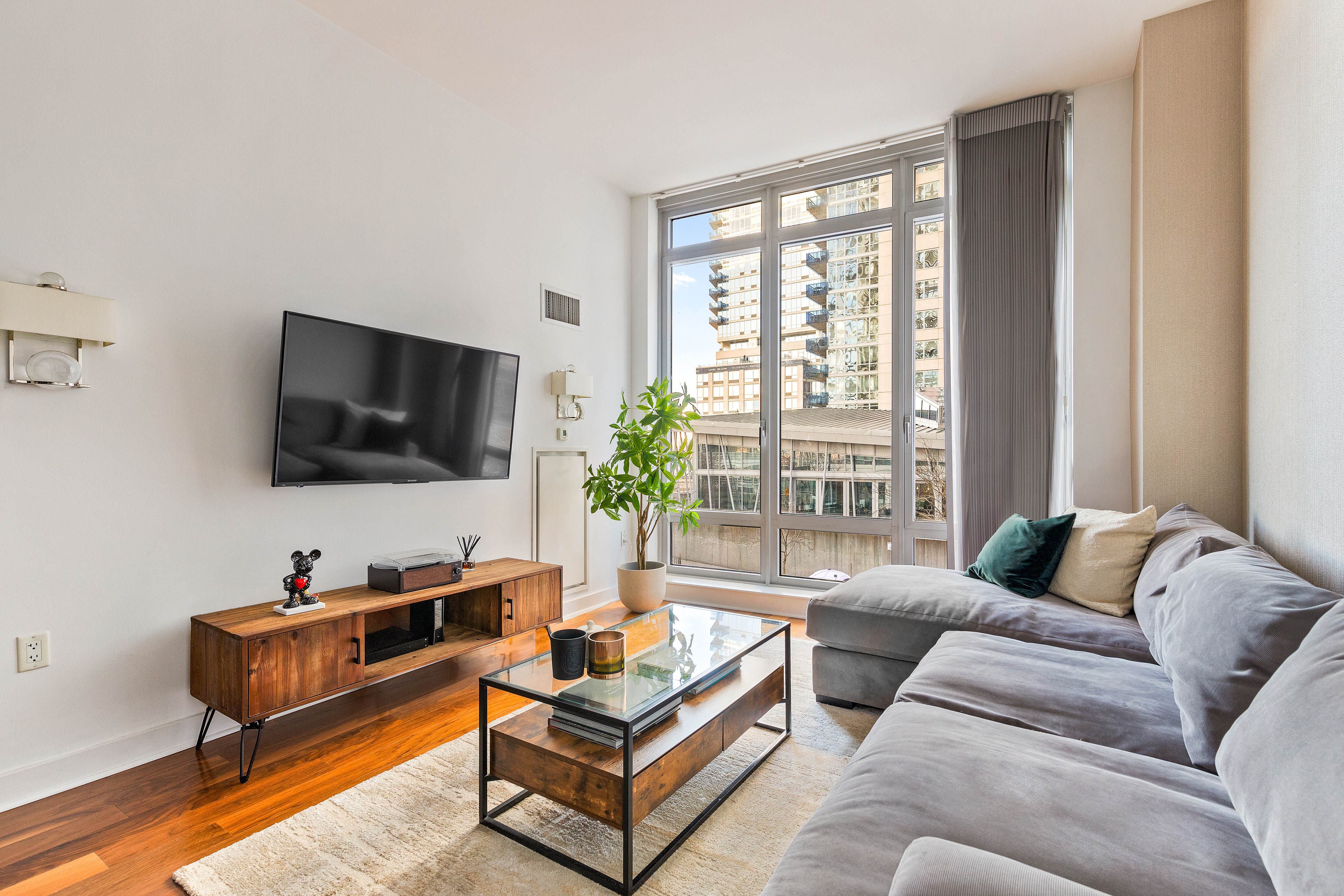 a living room with furniture and a flat screen tv