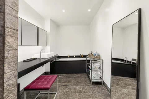 a kitchen with a stove a sink and a refrigerator