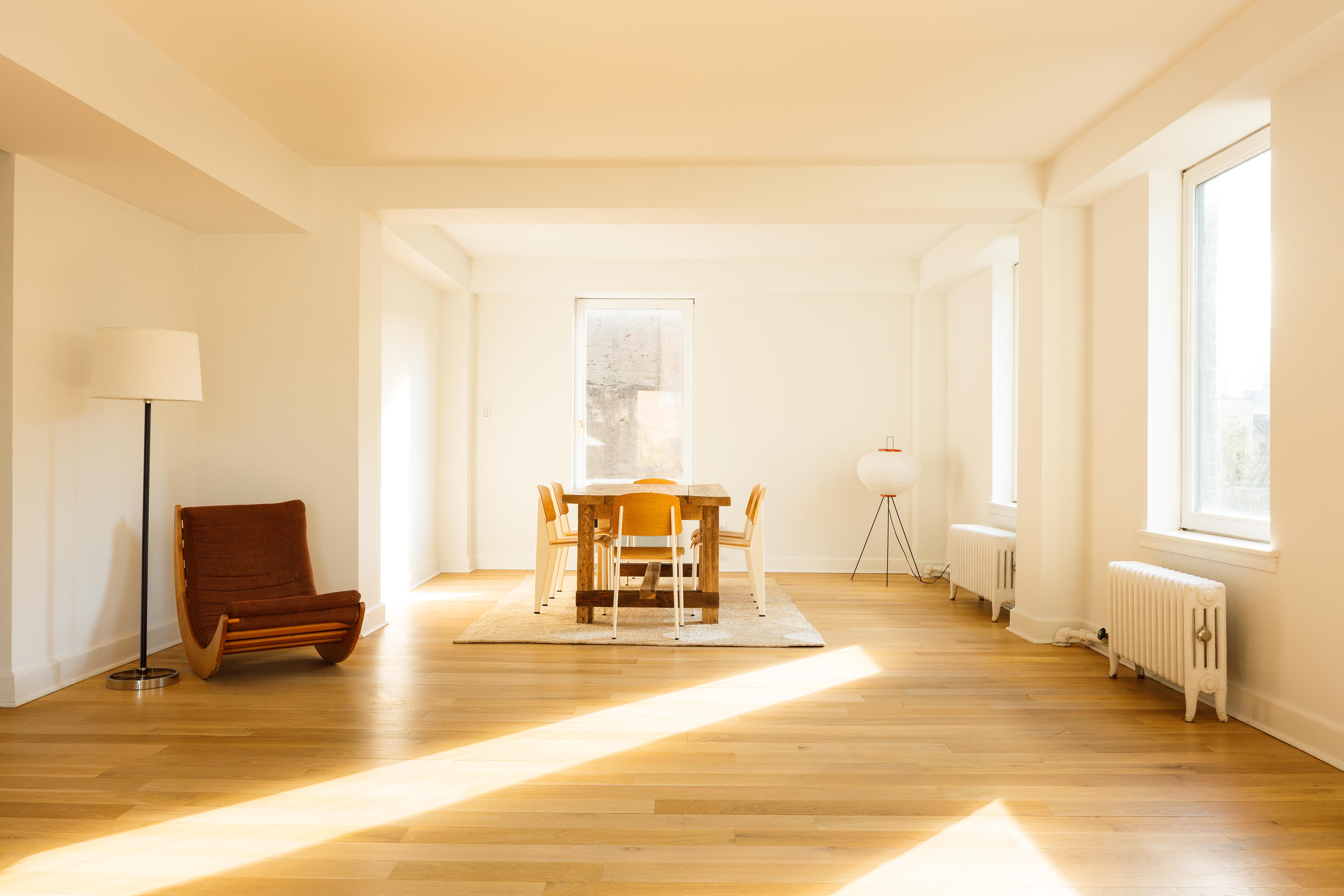 131 Avenue B, Unit 5C Manhattan, NY 10009 - Photo 5 of 18 a living room with furniture and a flat screen tv