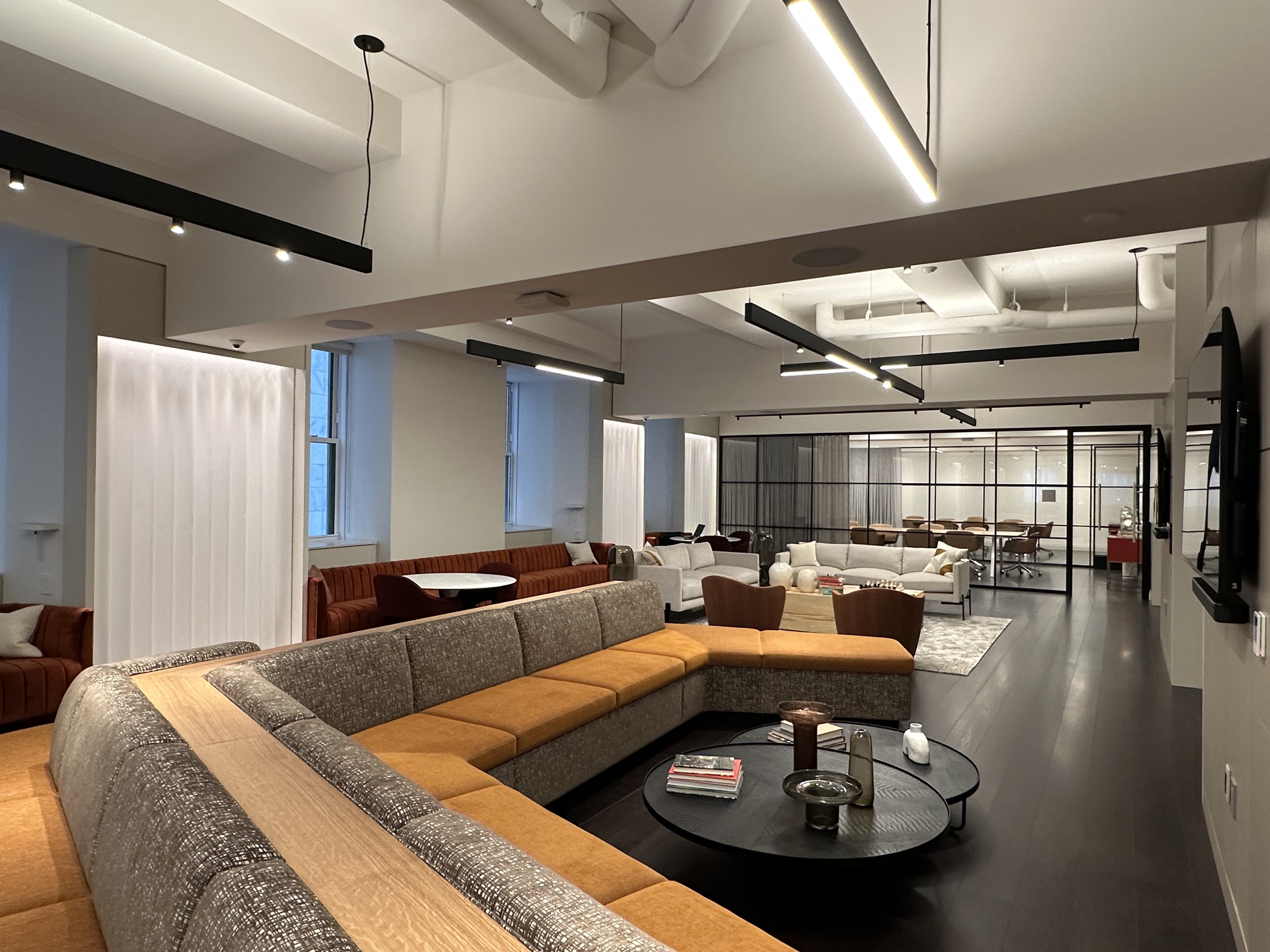 1 Wall Street, Unit 915 Manhattan, NY 10005 - Photo 14 of 18 a living room with furniture and a large window