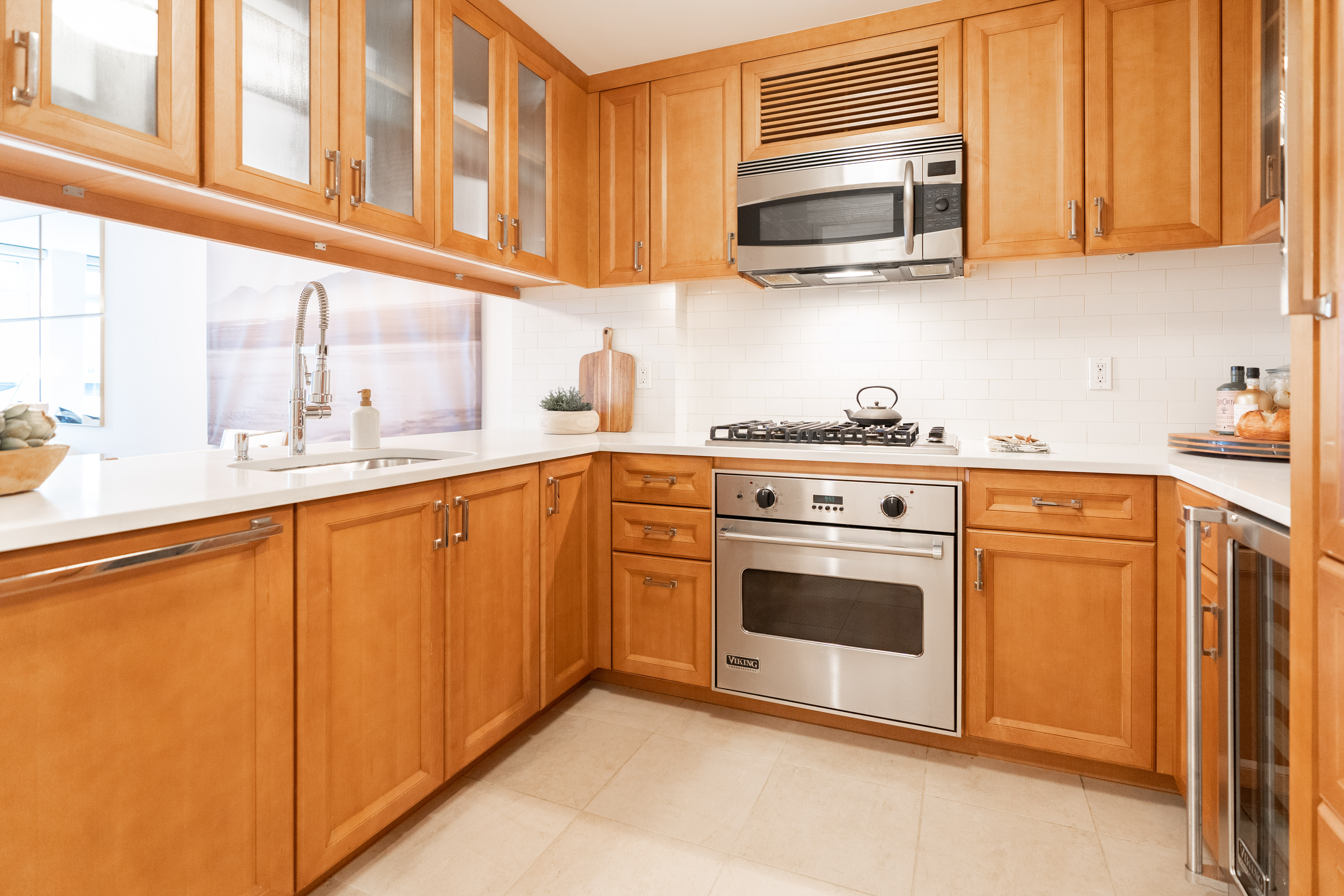205 East 85th Street, Unit G10 Manhattan, NY 10028 - Photo 5 of 27 a kitchen with stainless steel appliances granite countertop a sink and a microwave