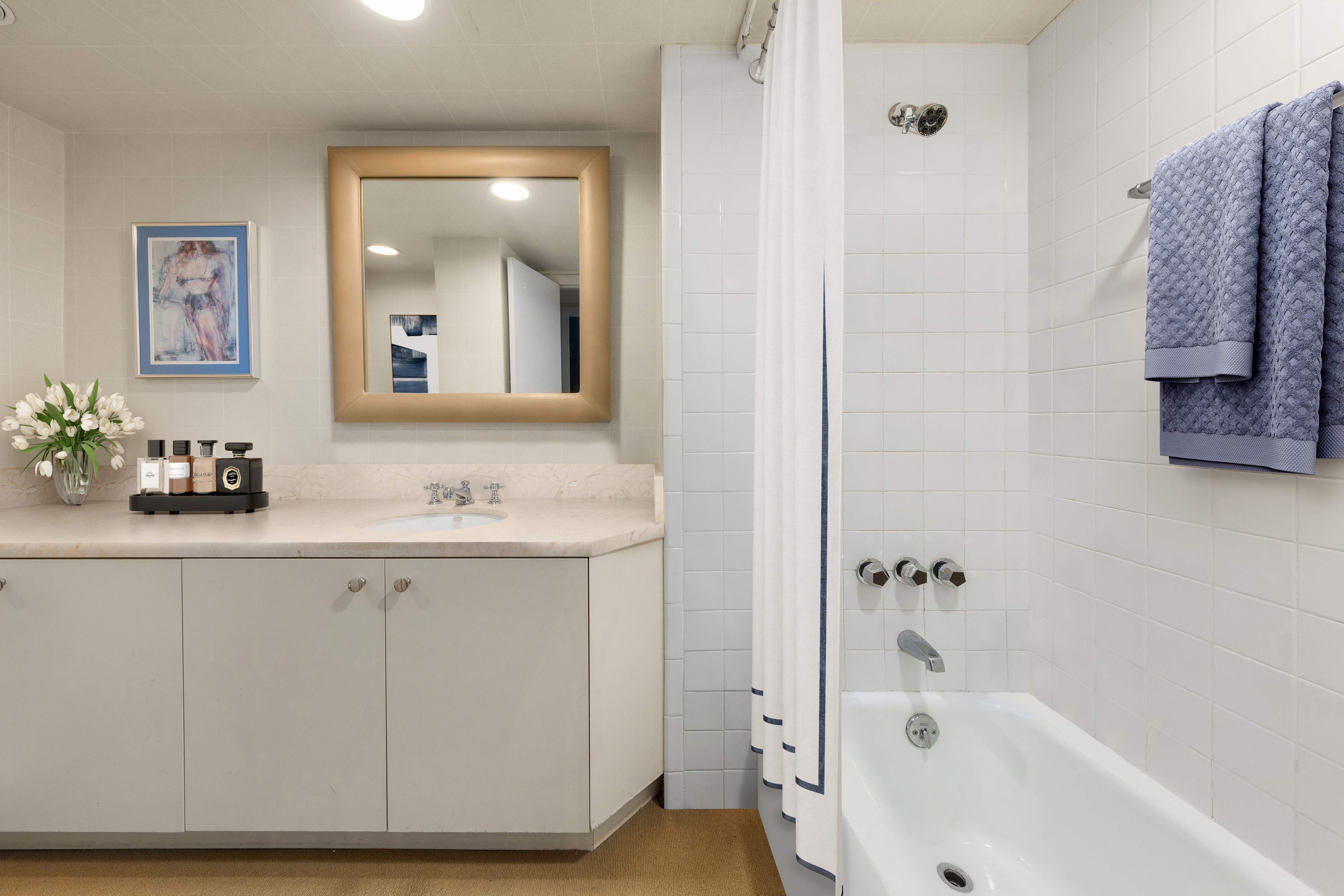 72 Horatio Street, Unit 1S Manhattan, NY 10014 - Photo 11 of 15 a bathroom with a sink and a bathtub
