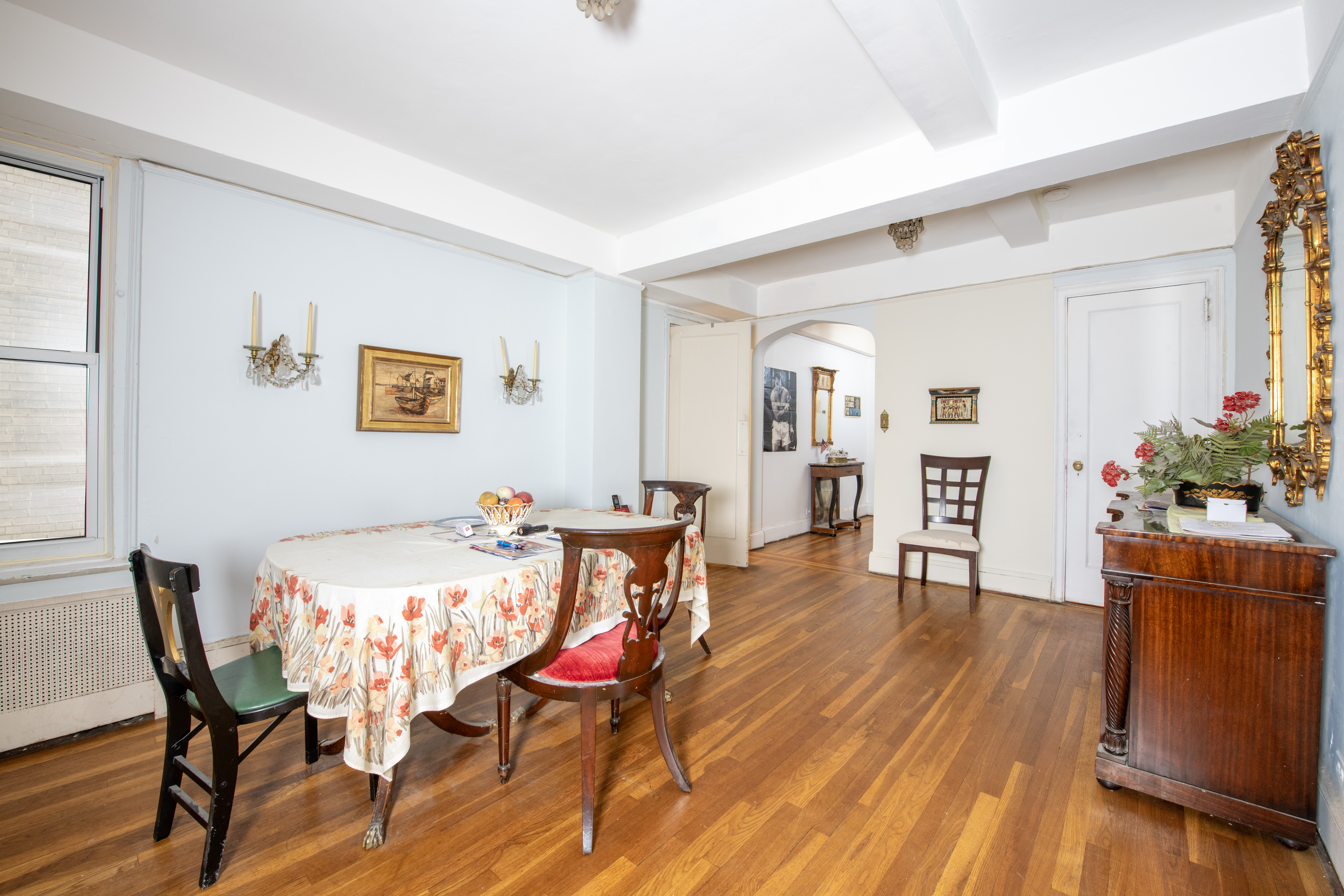 12 West 96th Street, Unit 9A Manhattan, NY 10025 - Photo 3 of 9 a view of a dining room with furniture and wooden floor