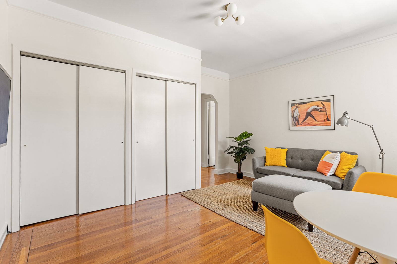 37-51 84th Street, Unit 21 Queens, NY 11372 - Photo 2 of 10 a living room with furniture and a wooden floor