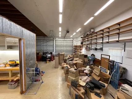 a living room with lots of furniture and a chandelier
