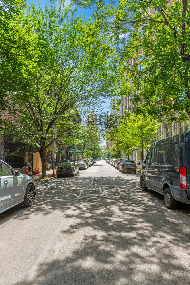 a view of street with parked cars